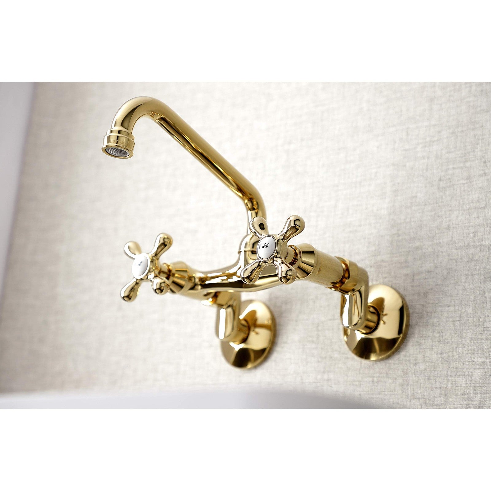 Kingston Brass Victorian two-handle wall mount kitchen faucet with 7-inch spout and polished finish.