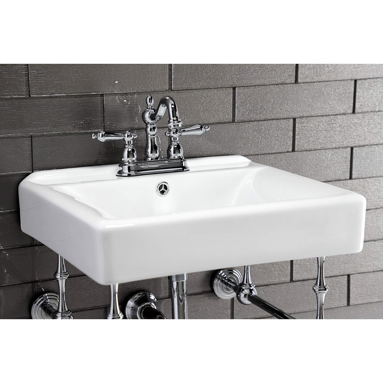 Kingston Brass Heritage 4-inch centerset lavatory faucet with metal lever handle, chrome finish, and traditional design.