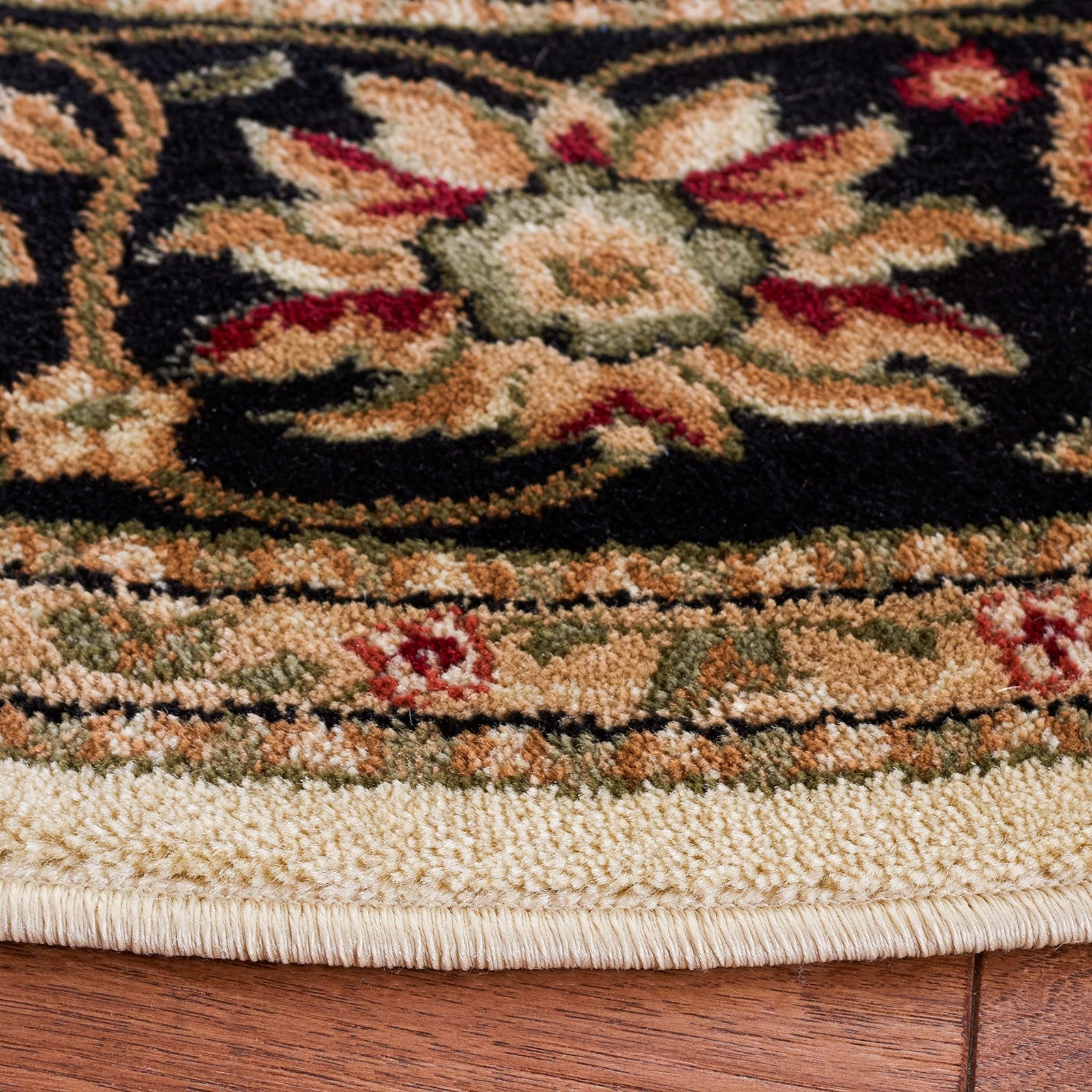 Safavieh Lyndhurst Ivory and Black round area rug with traditional patterns, 33 inches in diameter, woven design.