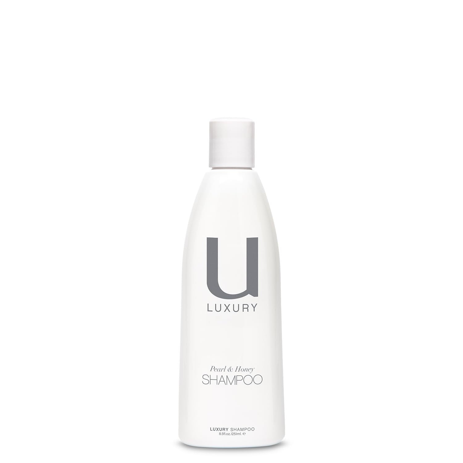 Bottle of UNITE Hair U:LUXURY Hydrating Shampoo with sleek packaging, designed to strengthen and repair hair.