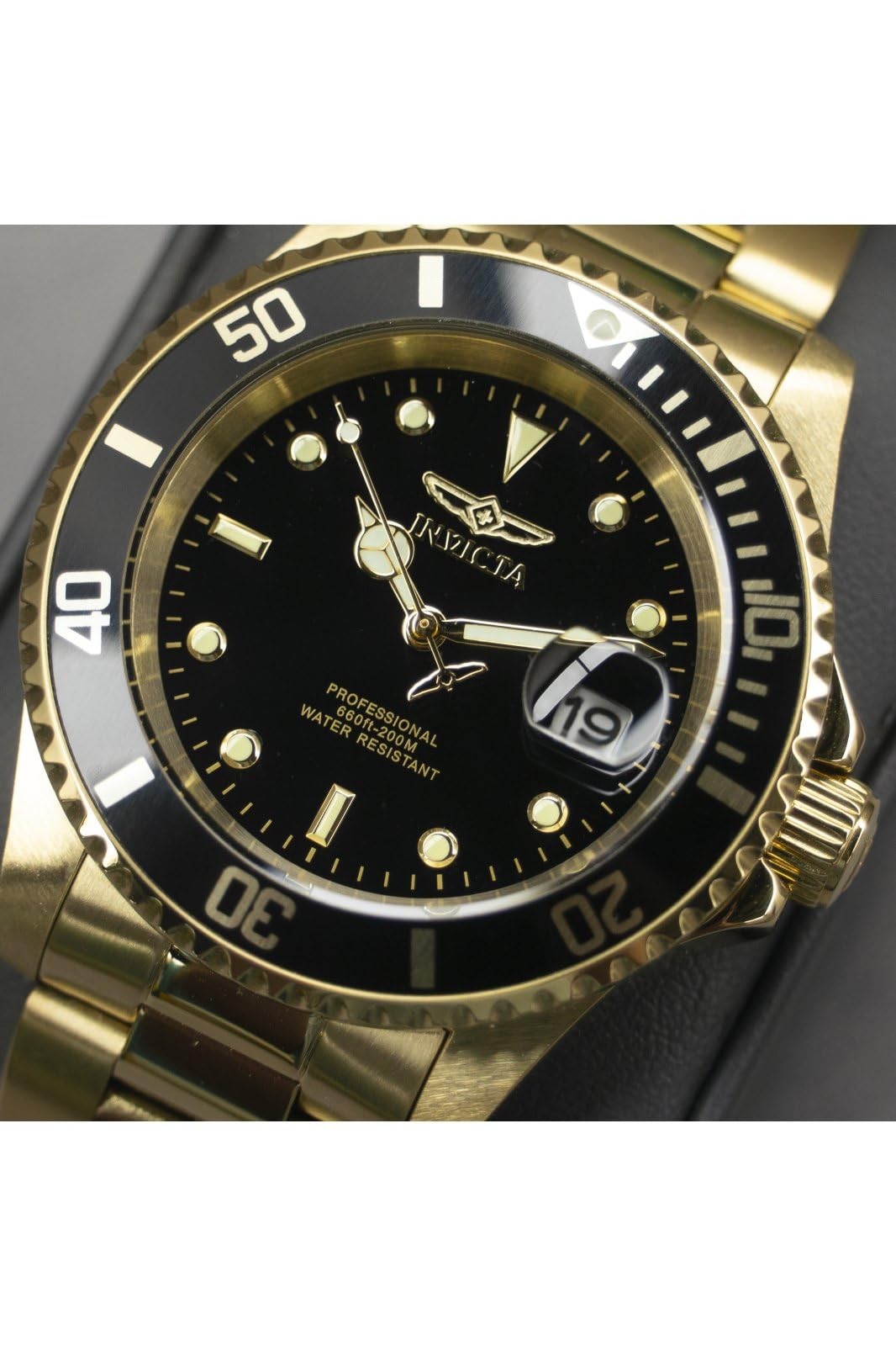 Invicta Men’s Pro Diver gold quartz watch with 20mm stainless steel band, displayed in box, showcasing elegant watch face and band.