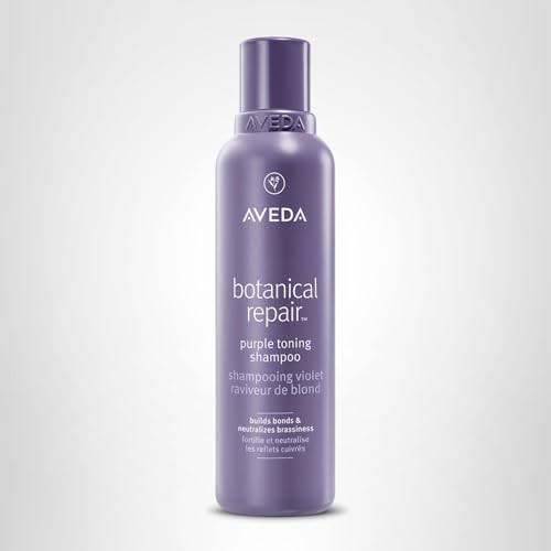Aveda Botanical Repair Purple Toning Shampoo for blonde, silver, and grey hair, featuring a sleek bottle with purple shampoo visible.