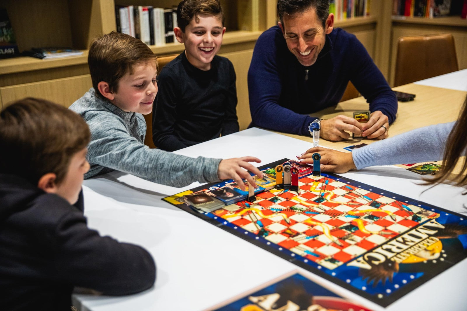 PragerU Celebrate America race to the White House board game with USA trivia cards and game pieces, designed for educational fun.