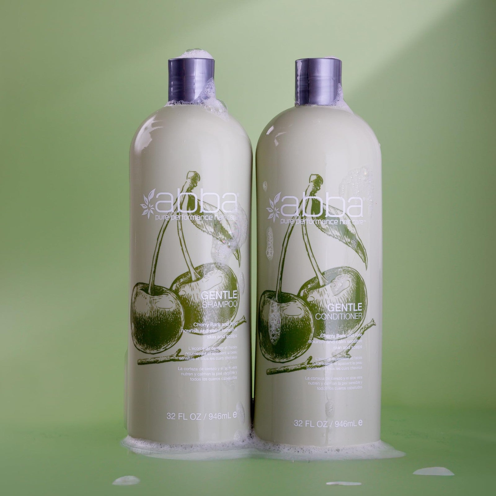ABBA Pure Gentle Conditioner with cherry bark and aloe in a 32 fl oz bottle, showing the conditioner's creamy texture and product label.
