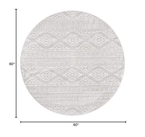 Round Safavieh Tulum Collection area rug with light grey and ivory Moroccan boho design, perfect for modern living spaces.