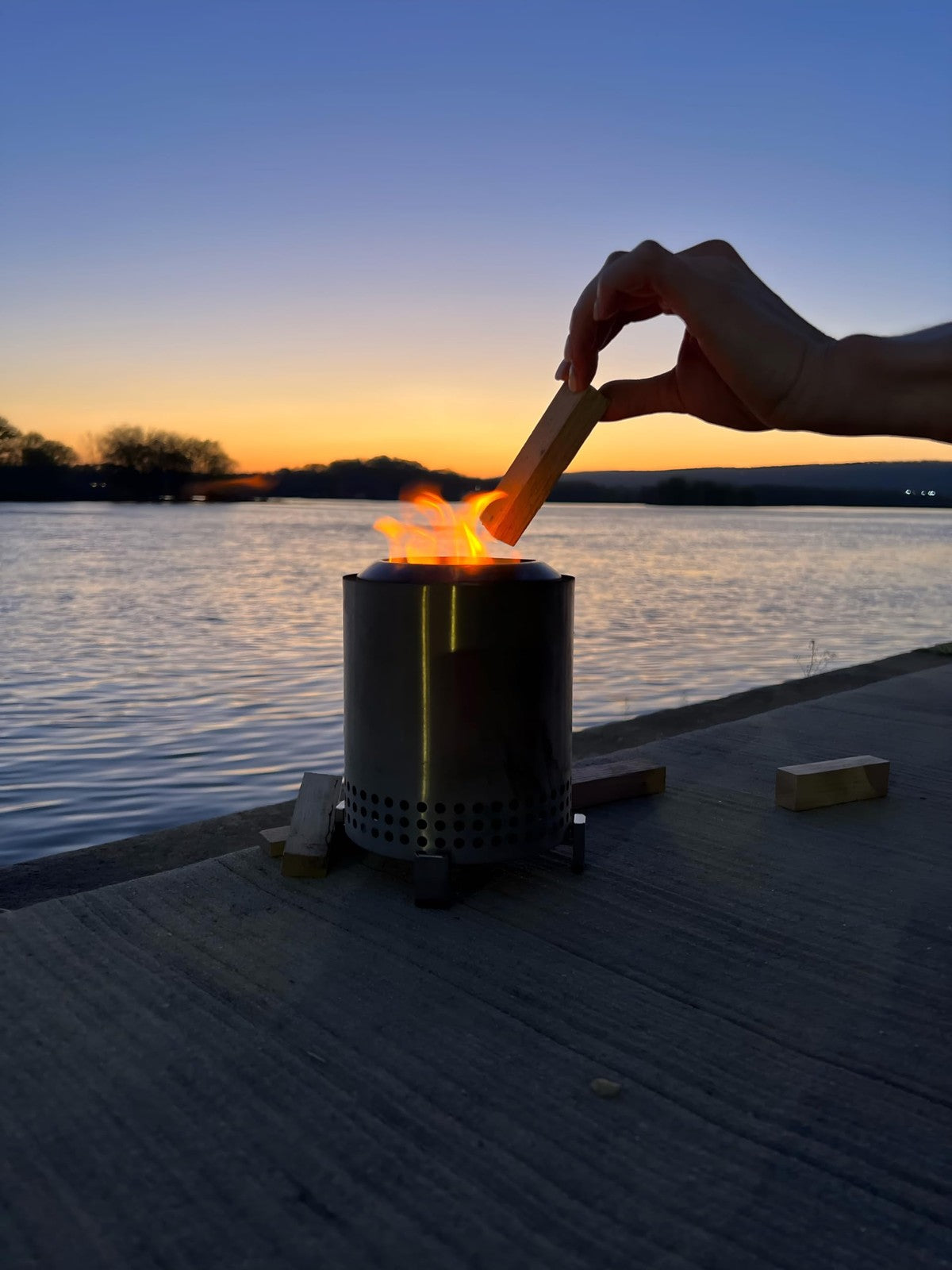 Tiny Timbers USDA Grade kiln dried hardwood logs ideal for table top fire pits and pizza ovens, neatly stacked and ready for use.