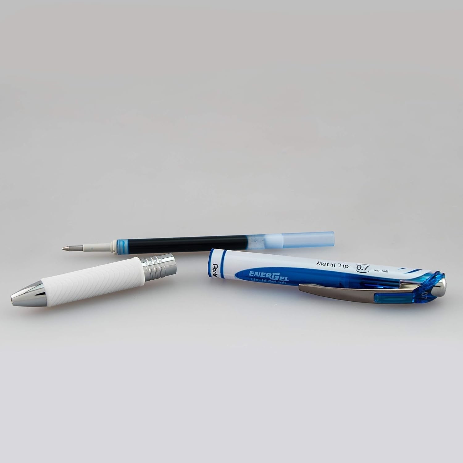 Pentel Energel Pearl medium point 0.7mm retractable metal tip pens, black ink, blue barrels, set of 10 on a white background.