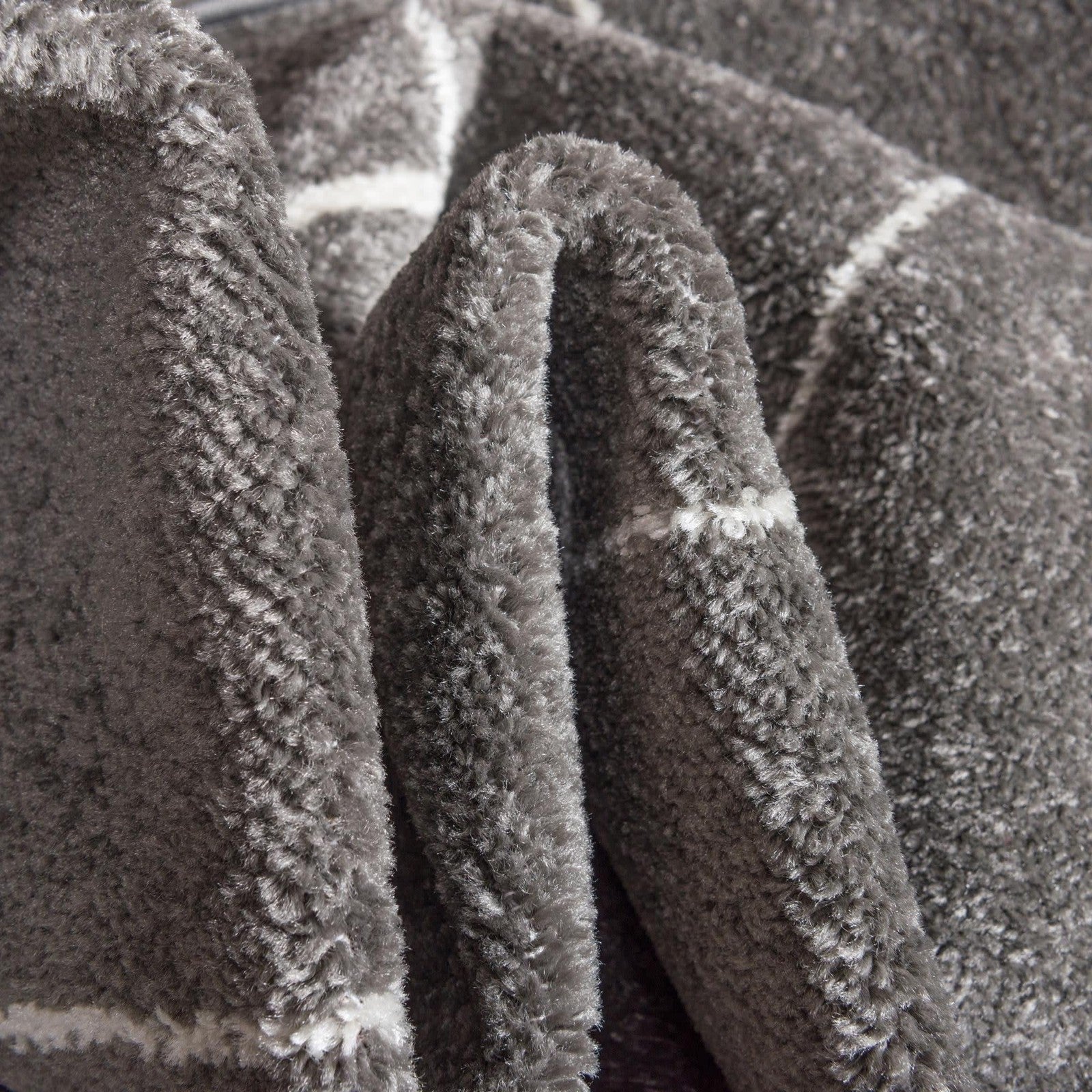 Dark gray geometric area rug from Unique Loom Trellis Frieze Collection with round shape and intricate pattern.