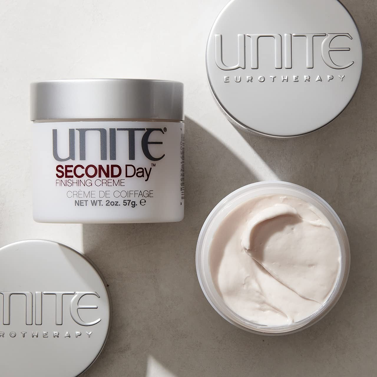 UNITE Hair Second Day Texturizing Finishing Cream applied to styled hair for a natural, effortless, lived-in look.