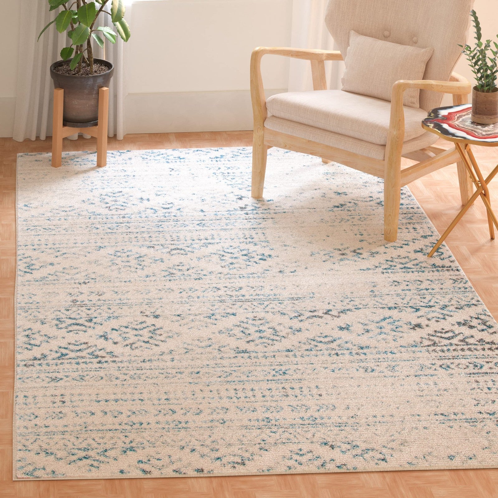 Safavieh Tulum Collection 6x9 ivory and turquoise Moroccan boho tribal area rug with tribal patterns and vibrant colors.