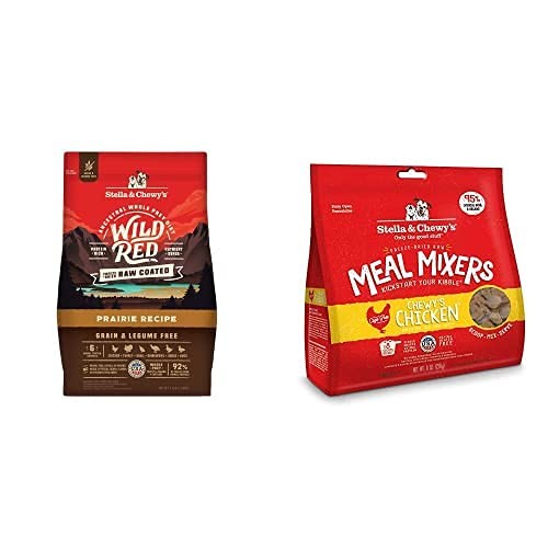 Close-up of Stella & Chewy's Wild Red Raw Coated Kibble dry dog food in a bowl, showing grain-free prairie recipe with red meat bits.