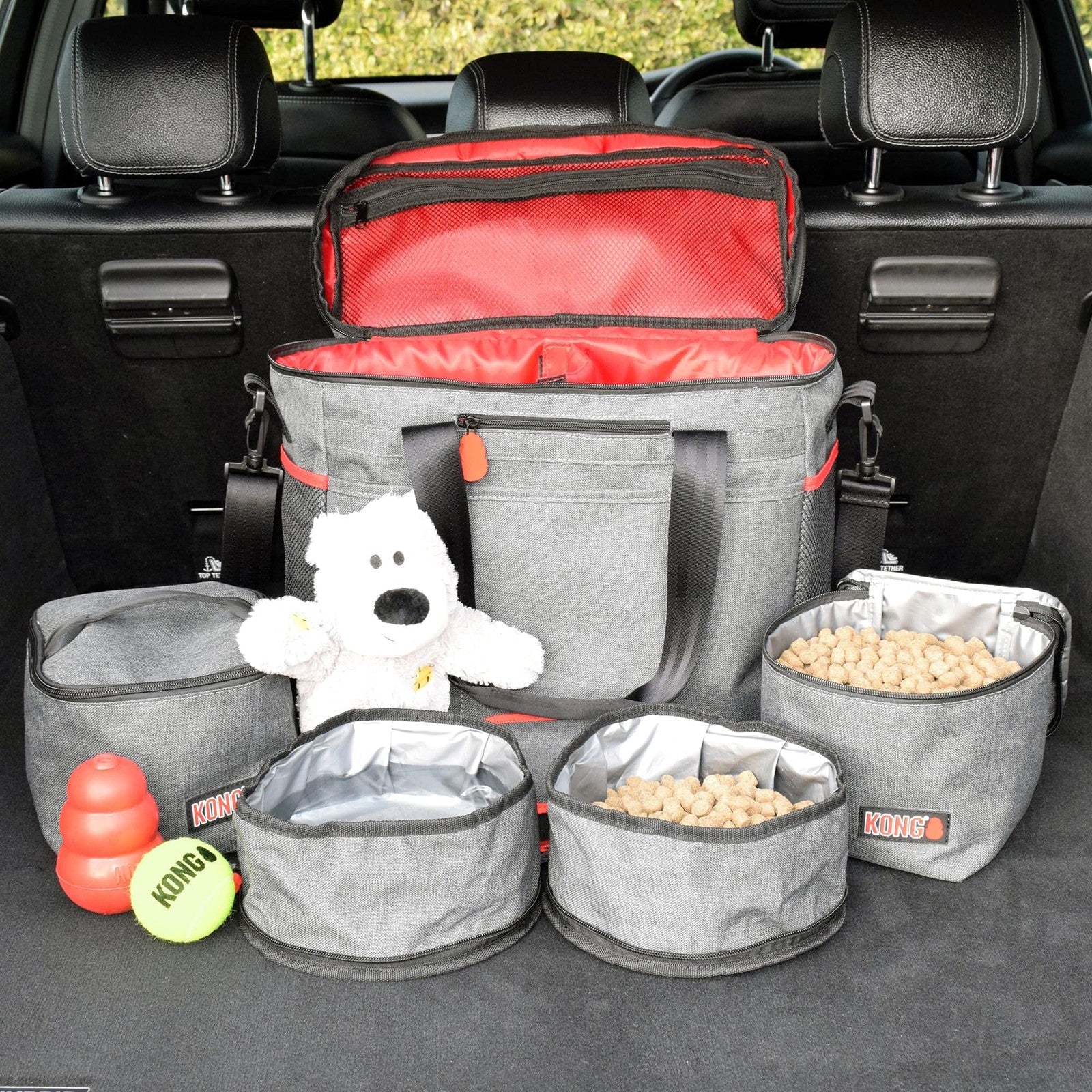 KONG 5-piece pet travel bag set with washable tote, food storage containers, and collapsible bowls for pet travel and feeding.