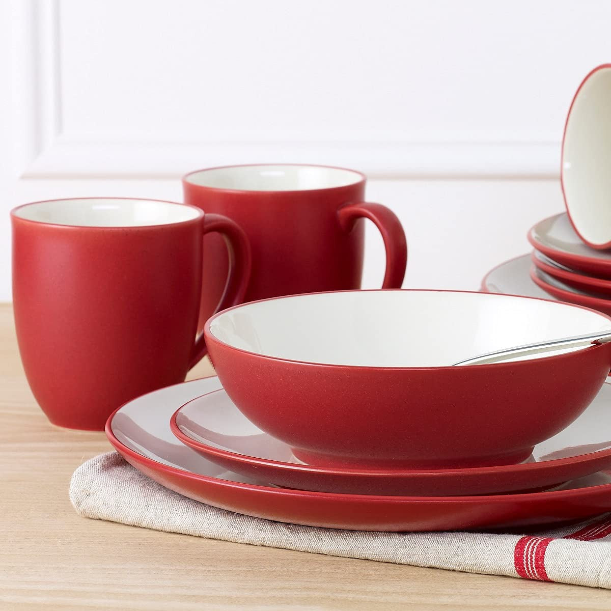 Noritake Colorwave Raspberry 12-inch pasta serving bowl with vibrant red and blue design, showing the bowl's interior and exterior.