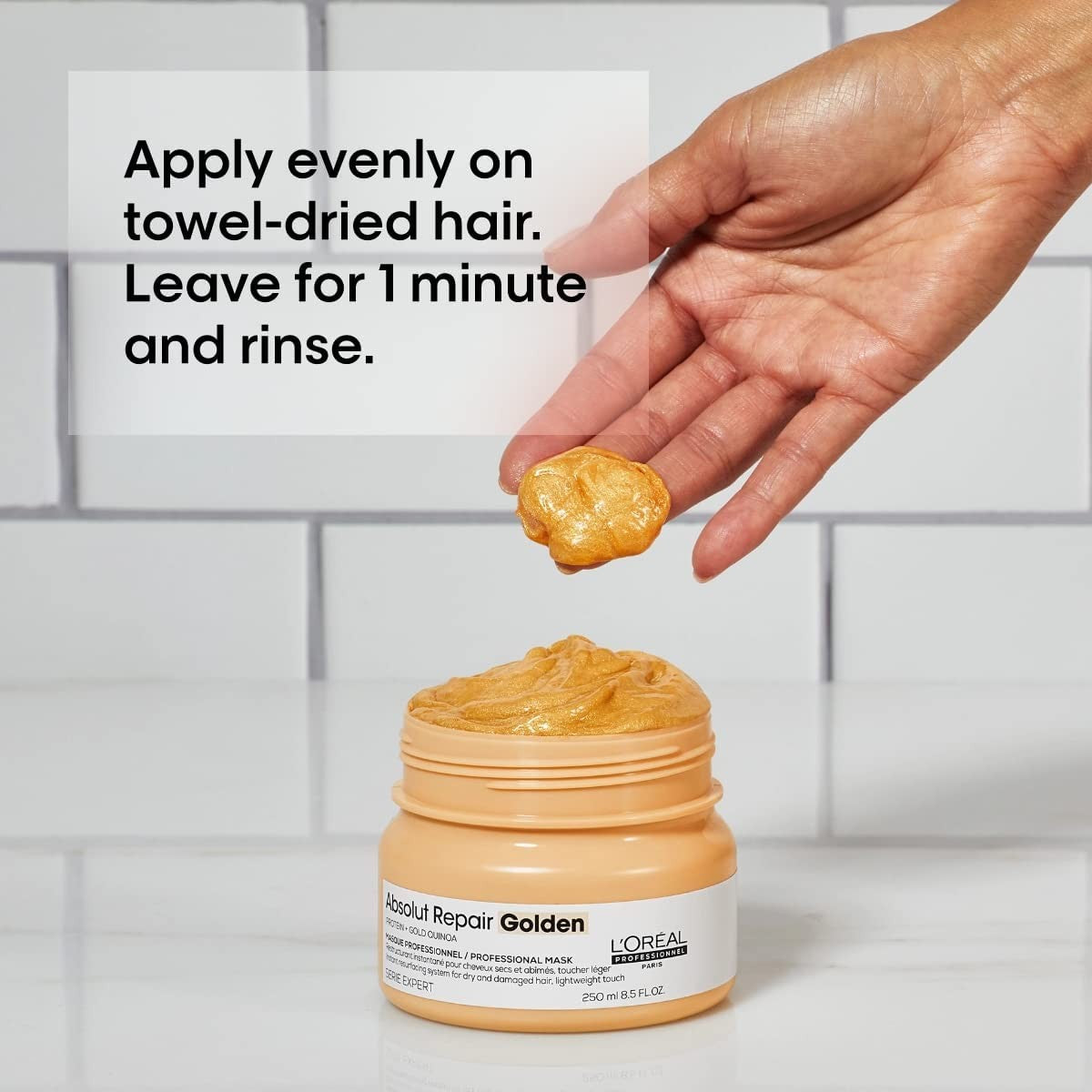 L'Oréal Professionnel Absolut Repair Golden Mask for damaged hair, creamy treatment in a jar with golden accents and product label.