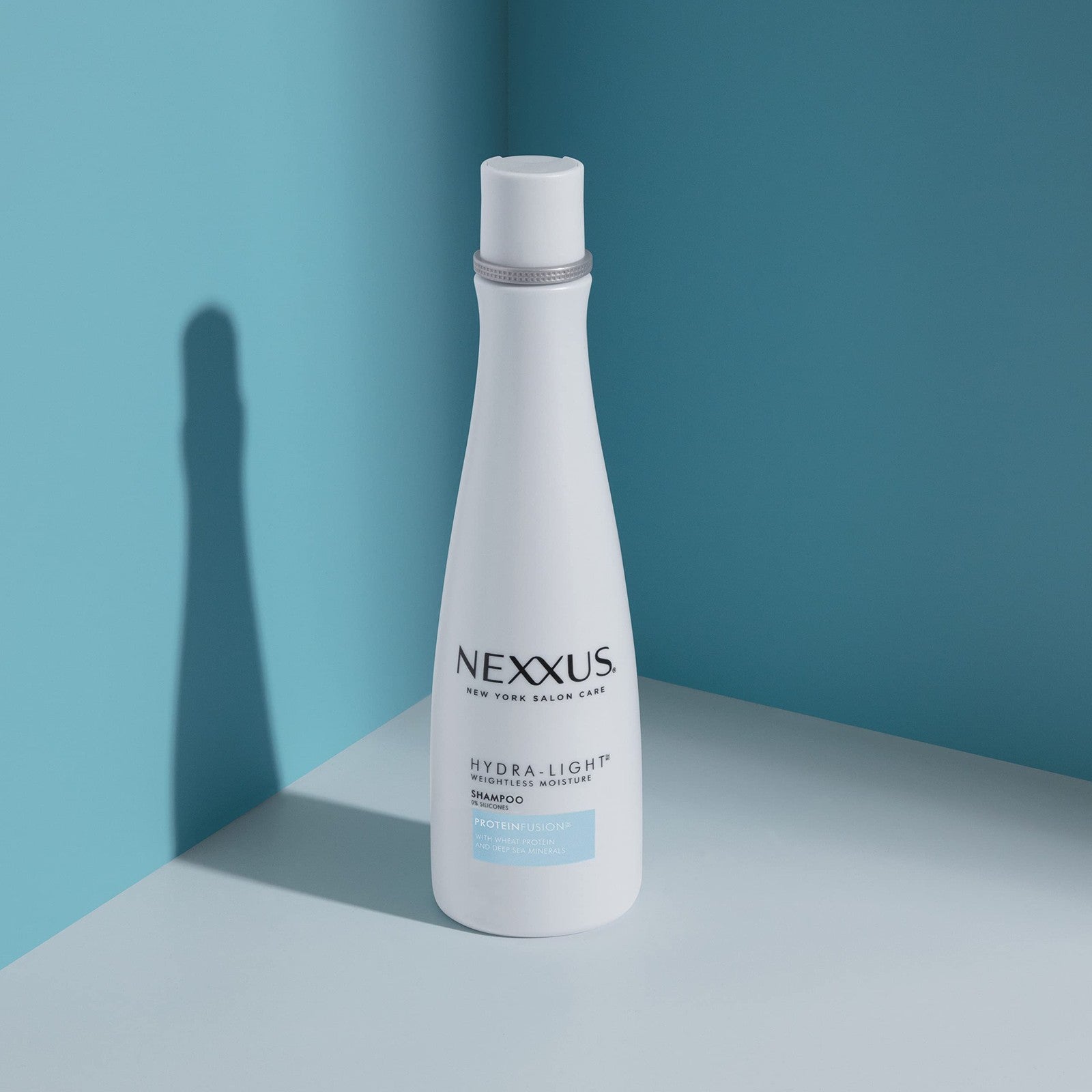 Nexxus Hydra-Light shampoo and conditioner for oily hair, 2-pack, lightweight hair care system with clear bottles and pump dispensers.