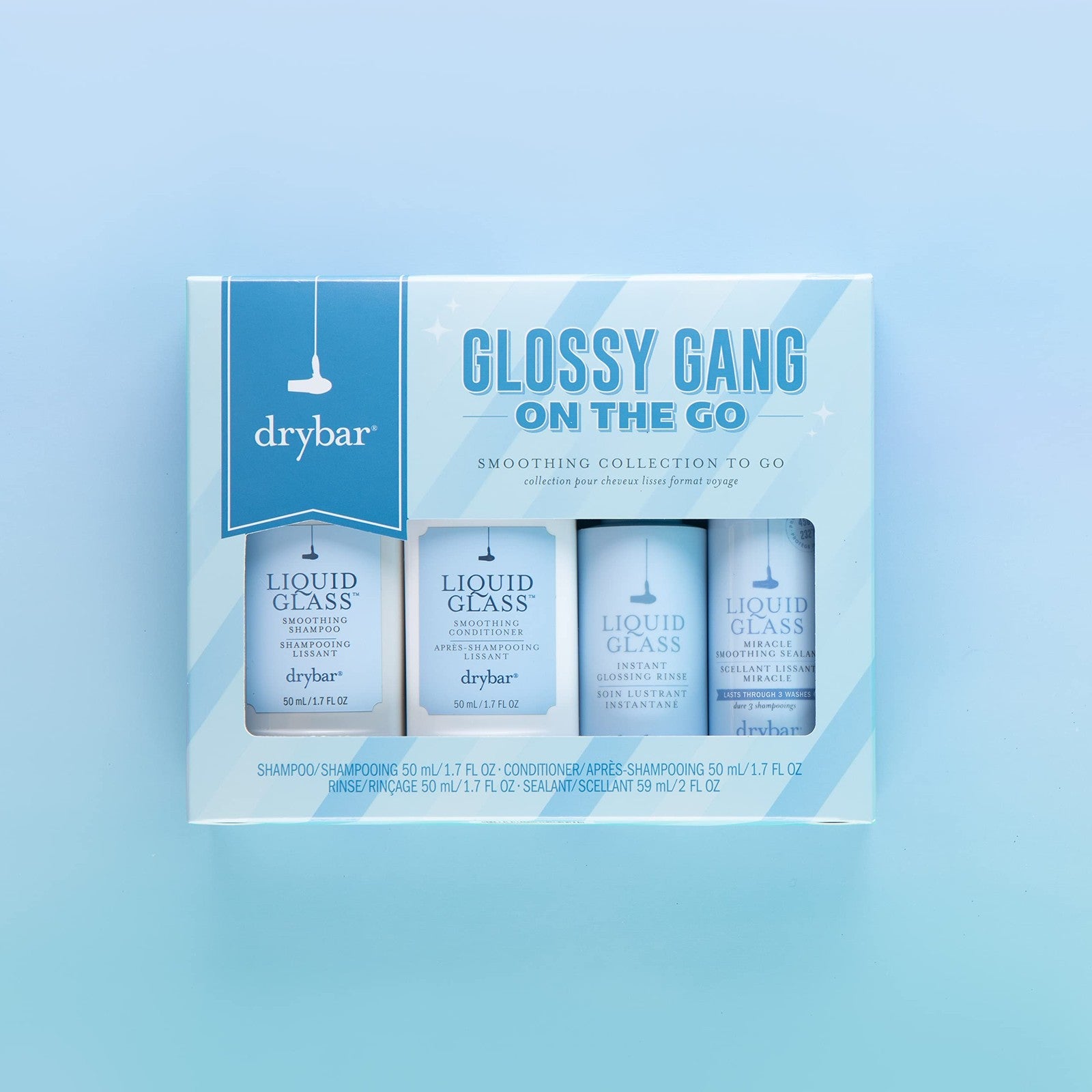 Drybar Glossy Gang On-the-Go Kit featuring travel-sized frizz control and shine products for sleek hair.