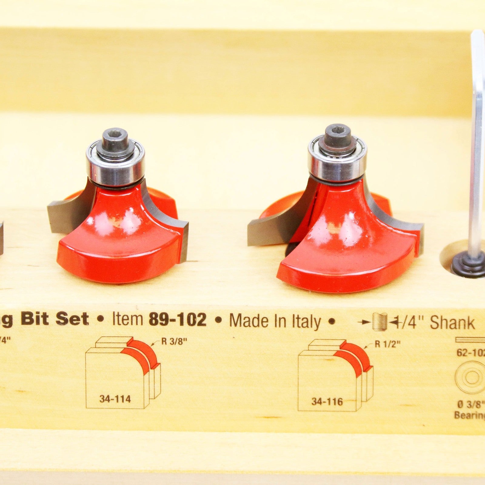 Freud 89-102 5-piece round over and beading router bit set with 1/4 inch shank, displayed on a workbench with woodworking tools.