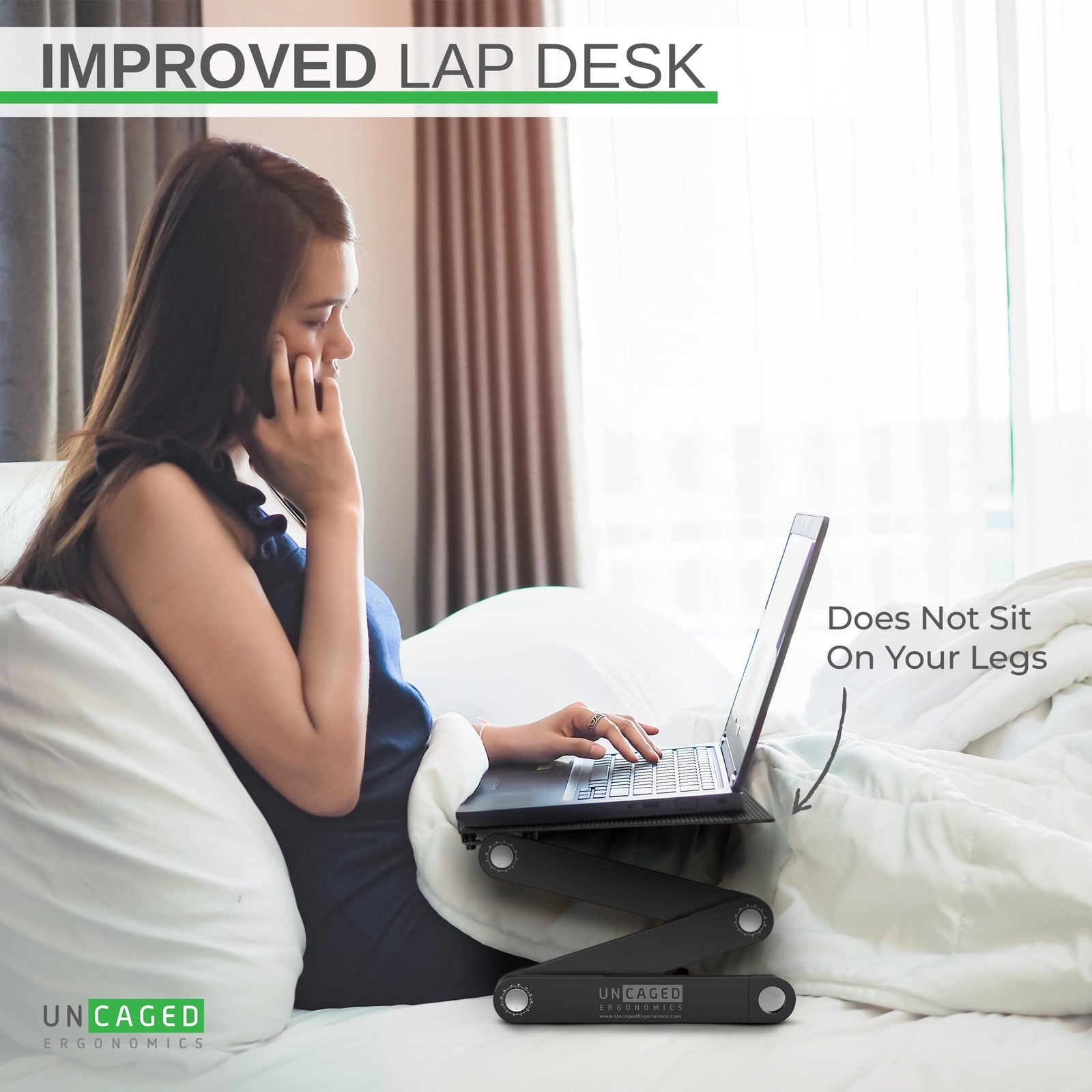 Uncaged Ergonomics WorkEZ adjustable laptop stand on a desk with a laptop, showing height adjustment and ergonomic design features.