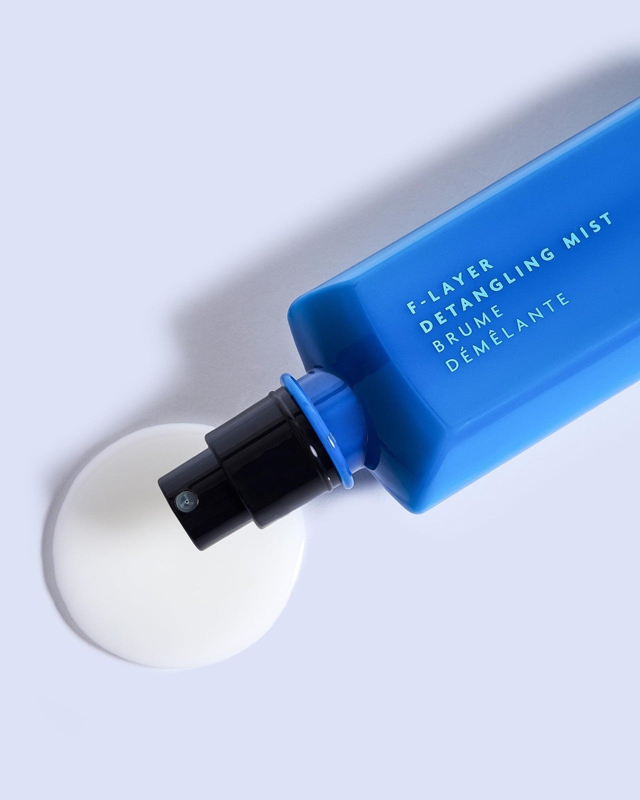 R+Co BLEU F-Layer Detangling Mist spray bottle for easy hair detangling and smoothness, 6.8 fl oz.
