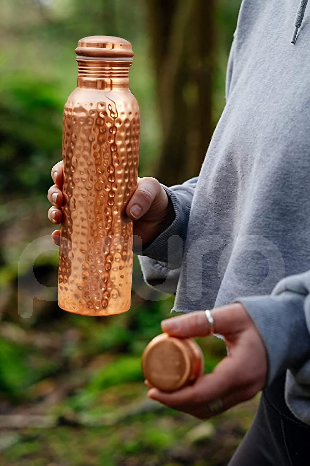 Hammered copper water bottle by Unbranded, traditional pure copper vessel with a smooth finish for Ayurvedic water storage.