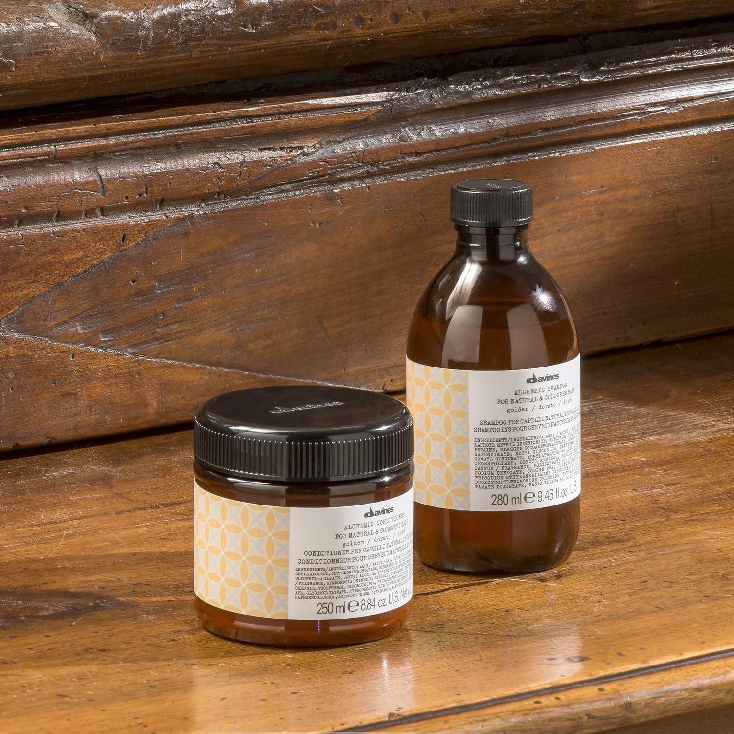 Davines Alchemic Conditioner Golden color depositing cream for golden blonde hair, shown in a tube with gold accents.