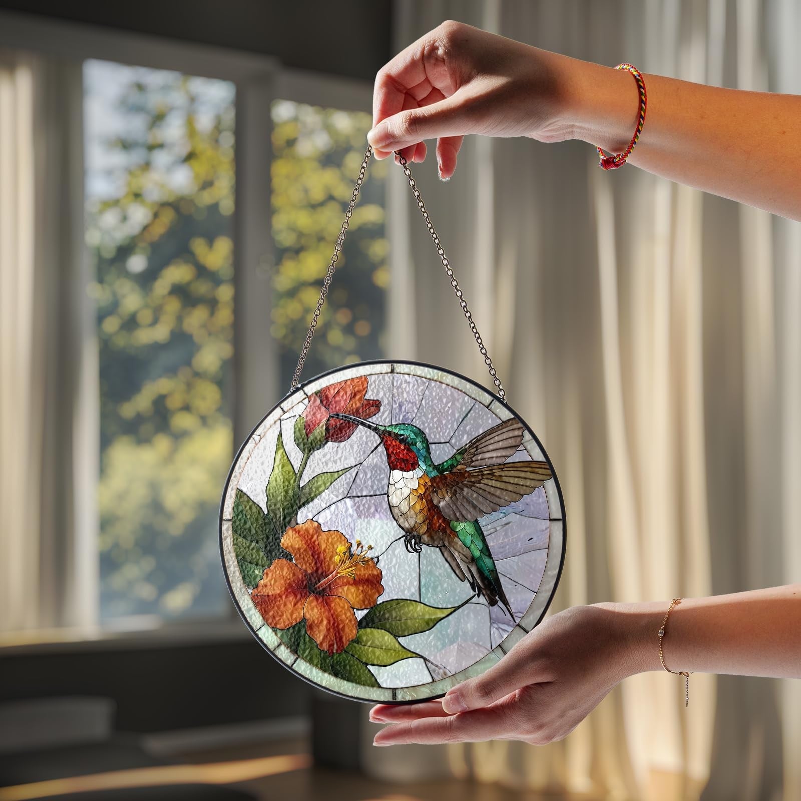 Vinatimes 6-inch green hummingbird stained glass suncatcher with colorful flowers and bird design hanging in sunlight.