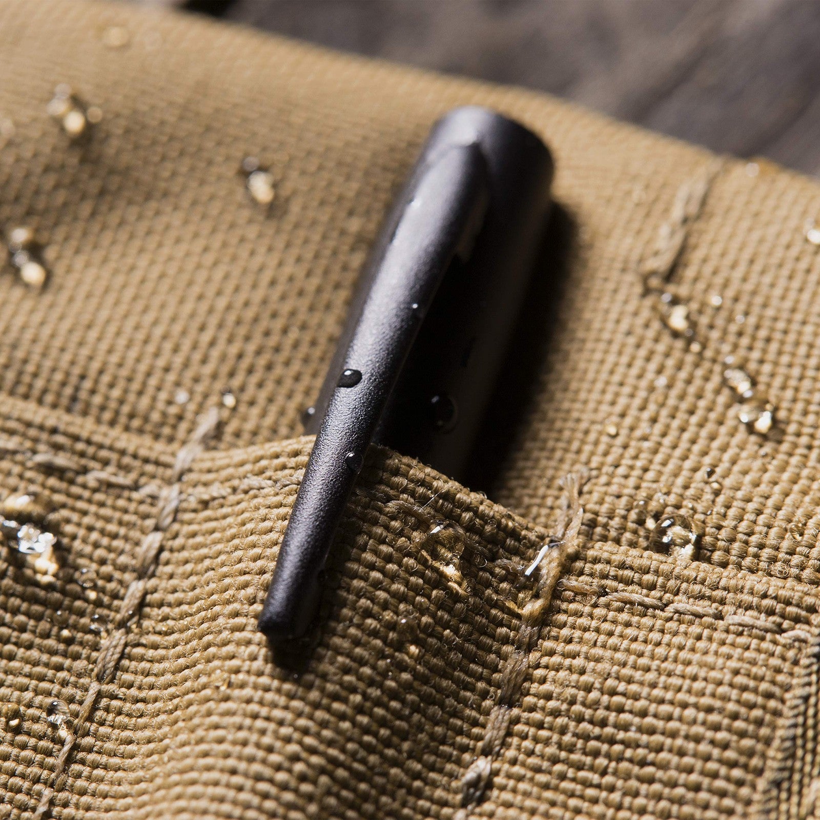 Rite in the Rain weatherproof 3x5 spiral notebook kit with tan CORDURA cover and pen, durable for outdoor note-taking.