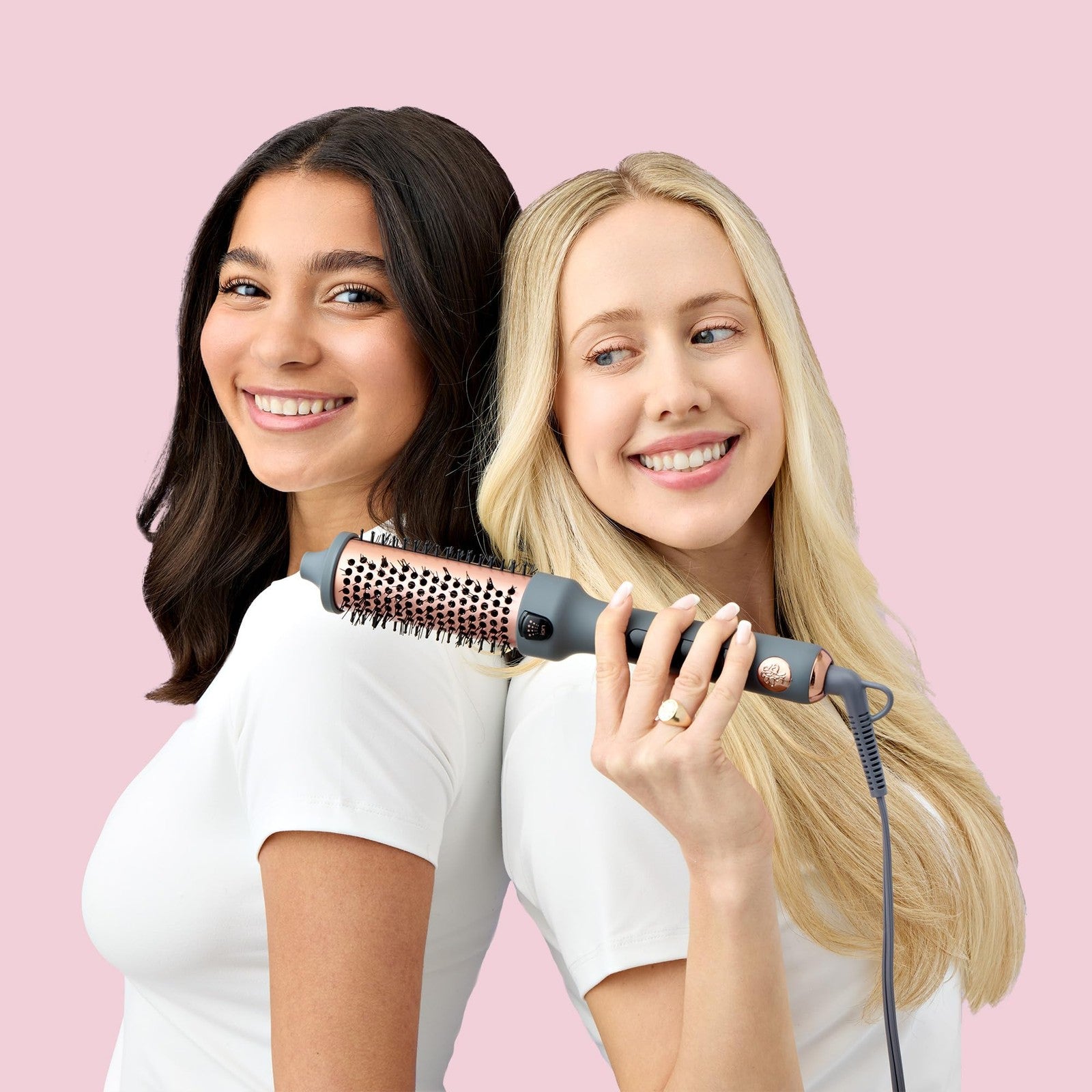 Hairitage Heated Curl Brush with 1.5-inch thermal round barrel for smooth, frizz-free curls and styled hair.