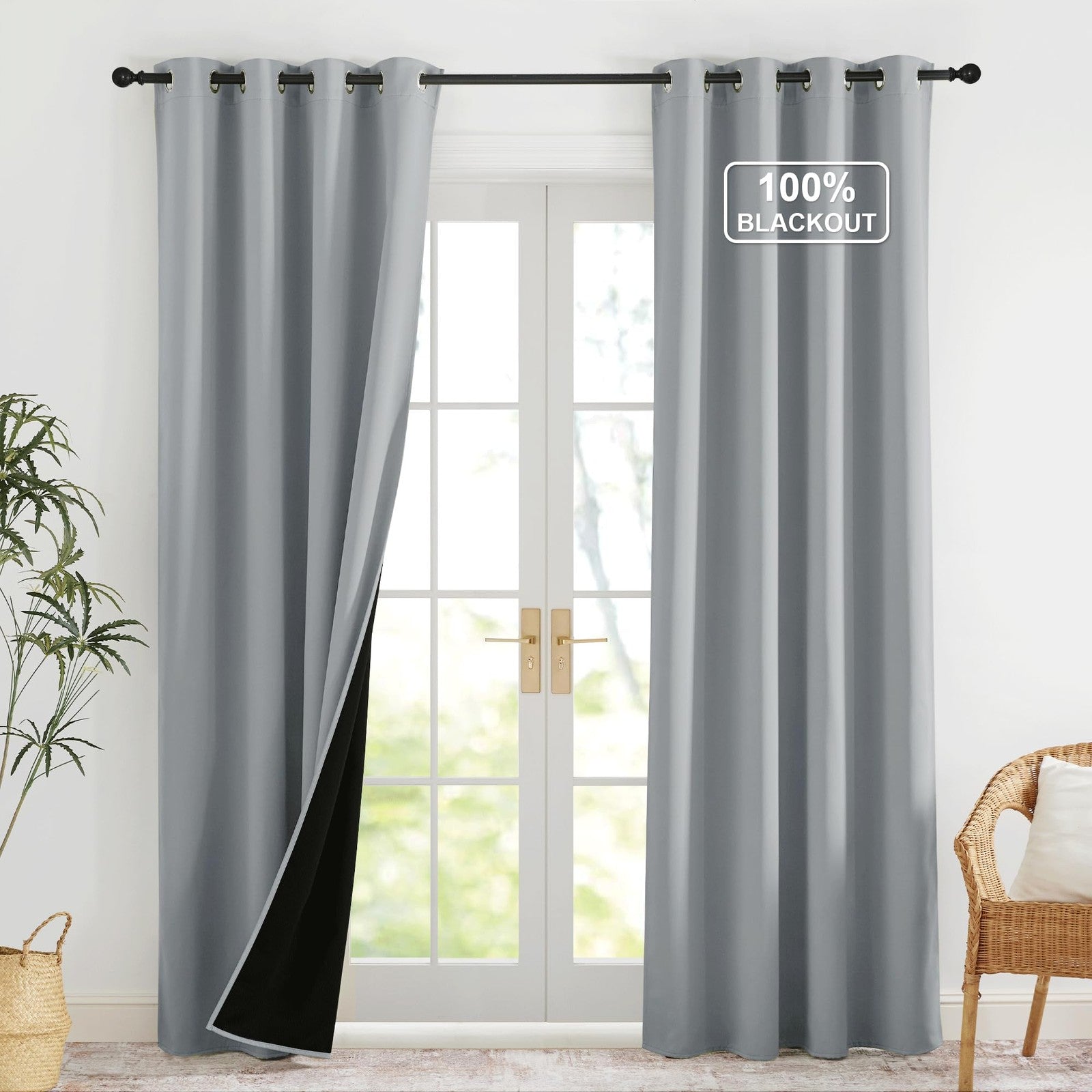 NICETOWN grey blackout curtains in 52x84 inches, two thermal room darkening panels hanging on a window.