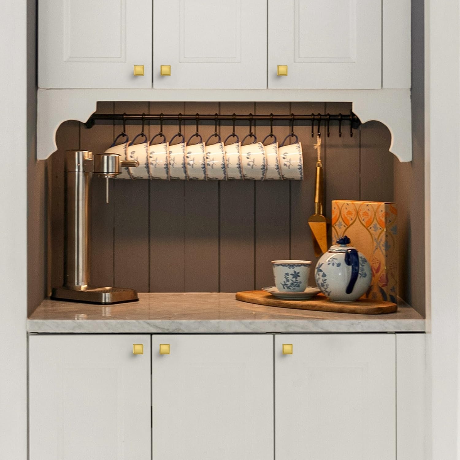 Set of 10 Ravinte brushed brass kitchen square cabinet knobs, solid metal drawer pulls with a sleek, modern design.