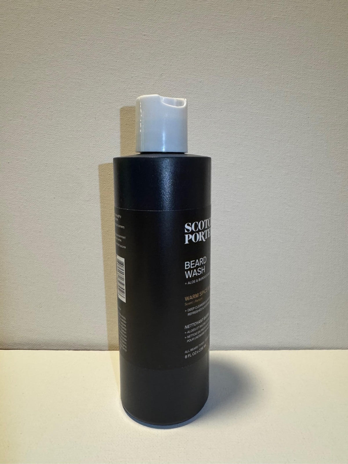 Beard wash in a bottle labeled Scotch Porter Moisturizing Beard Wash for cleansing and hydrating coarse, dry beards.