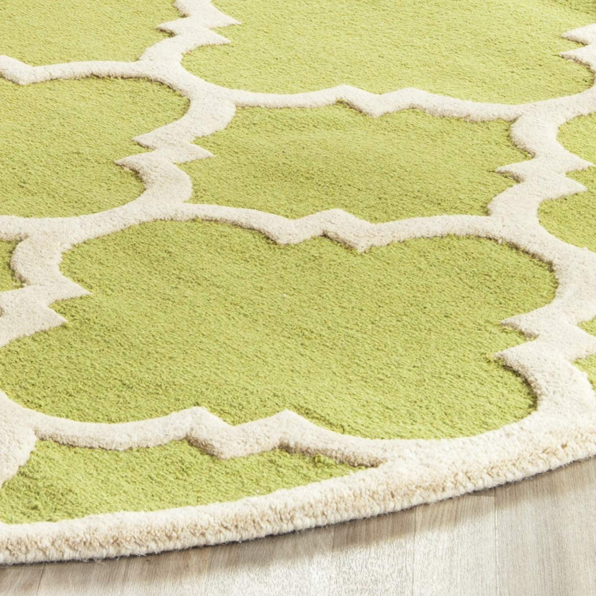 Handmade Safavieh Cambridge Moroccan rug with a 6-foot round green and ivory design featuring intricate patterns.