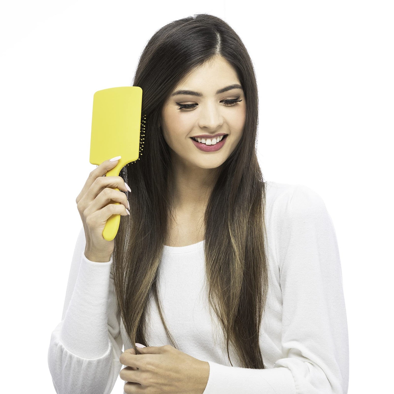 Drybar The Lemon Bar paddle brush with yellow handle and bristles, designed for detangling and smoothing hair.