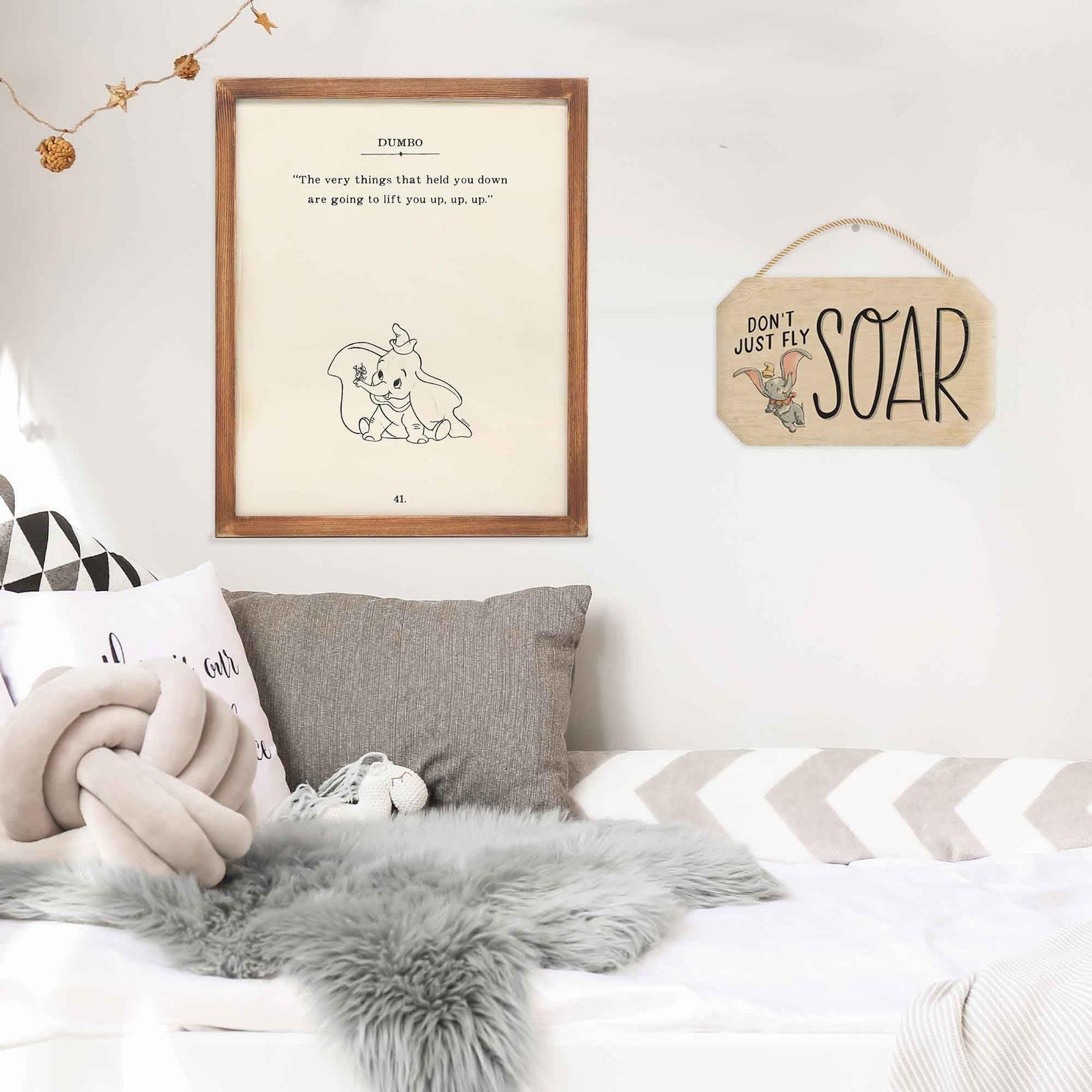 Framed wood wall art featuring Disney Dumbo with the quote "The Very Things That Bring You Down" by Open Road Brands.