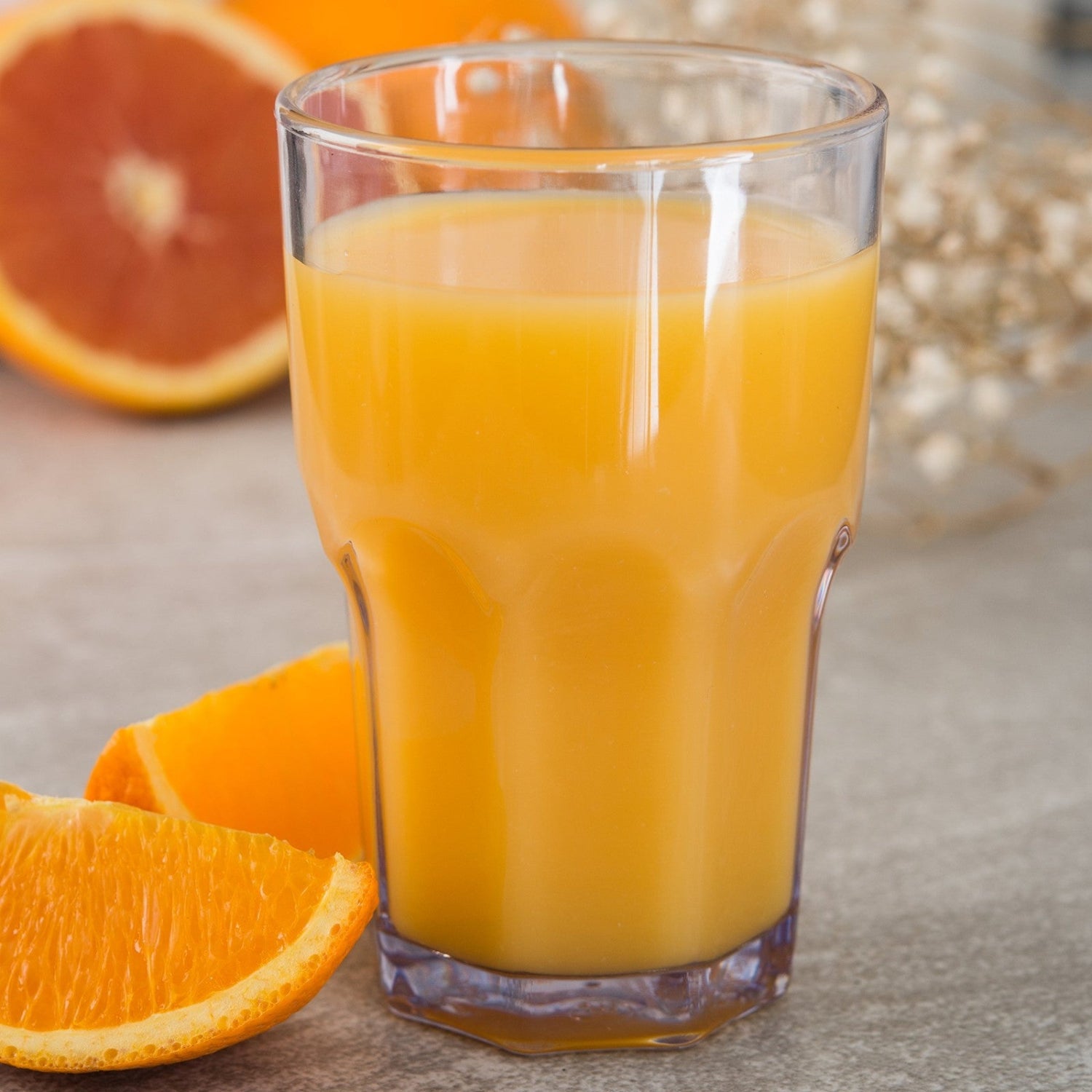 Carlisle Foodservice Products Louis clear tall glass tumbler for restaurant use, showcasing its transparent design and cylindrical shape.