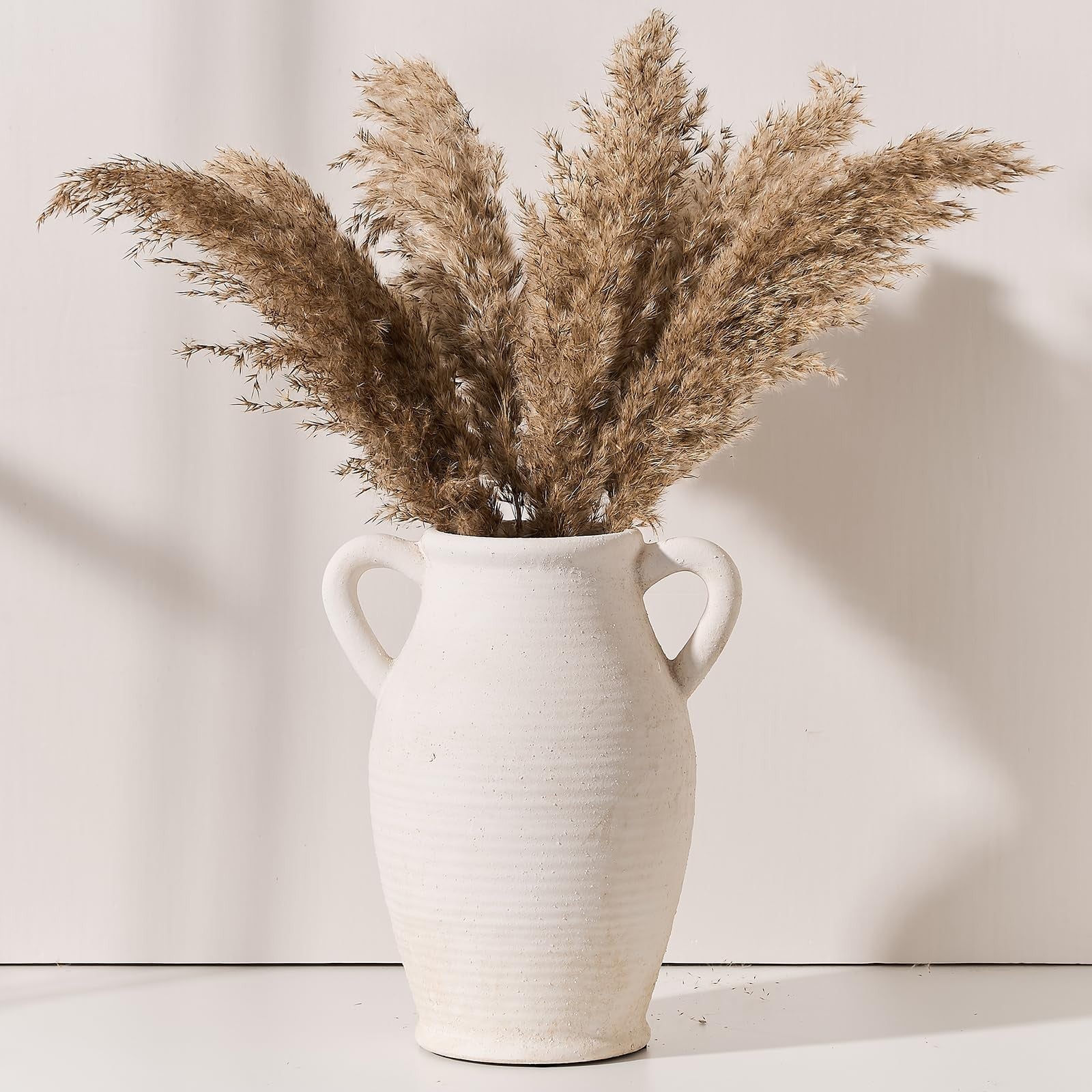 Large rustic ceramic Vaseking vase with two handles, styled for an emotionally grounded home decor display.