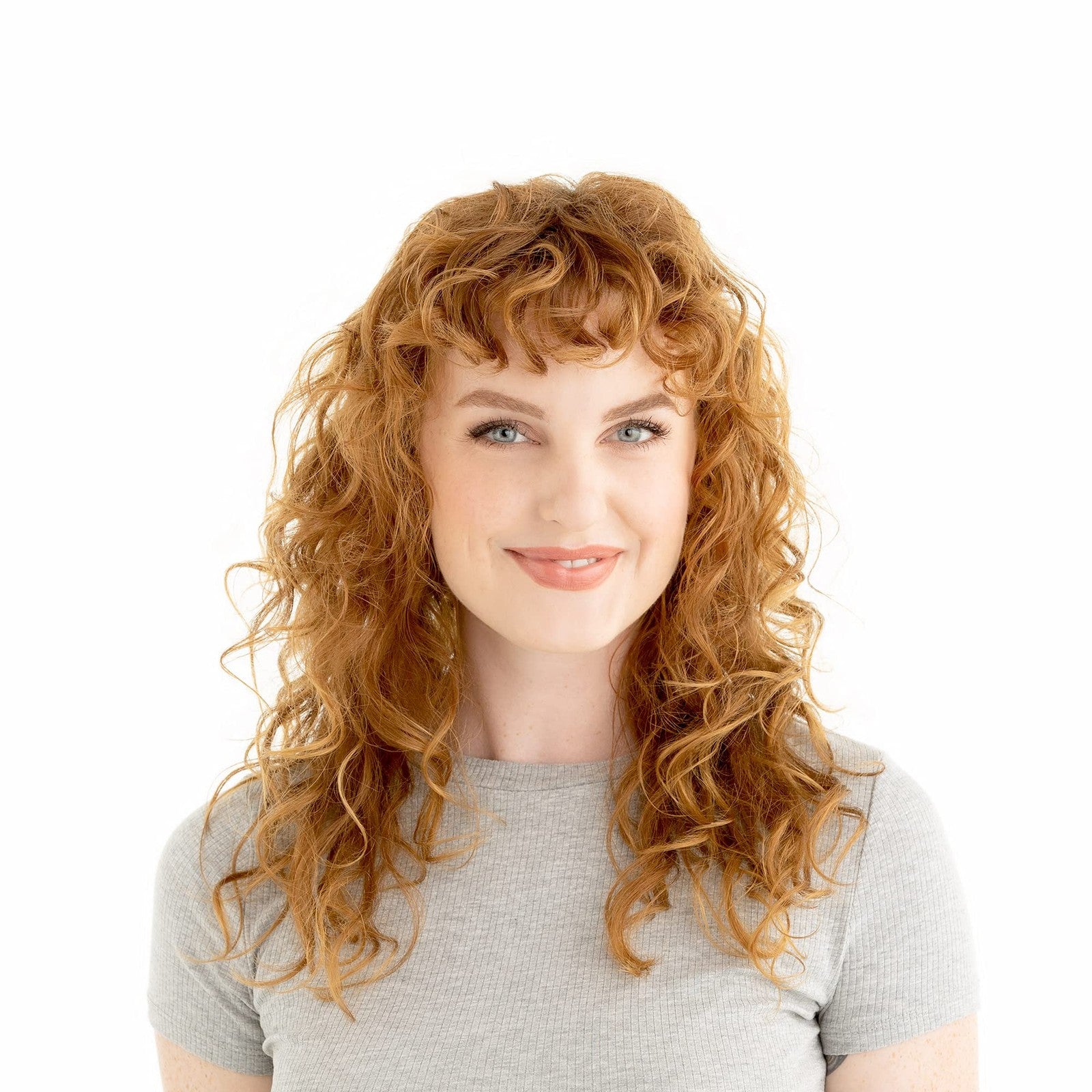 Drybar The Bouncer diffuser for curly hair, universal fit, showing a hand holding the diffuser attachment for frizz reduction.