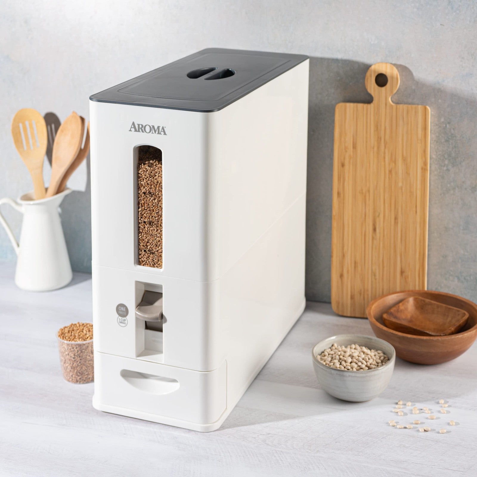 Aroma Housewares large white rice dispenser with 27lb capacity, measuring 7.25x16.5x16.5 inches, featuring a clear lid and spout.