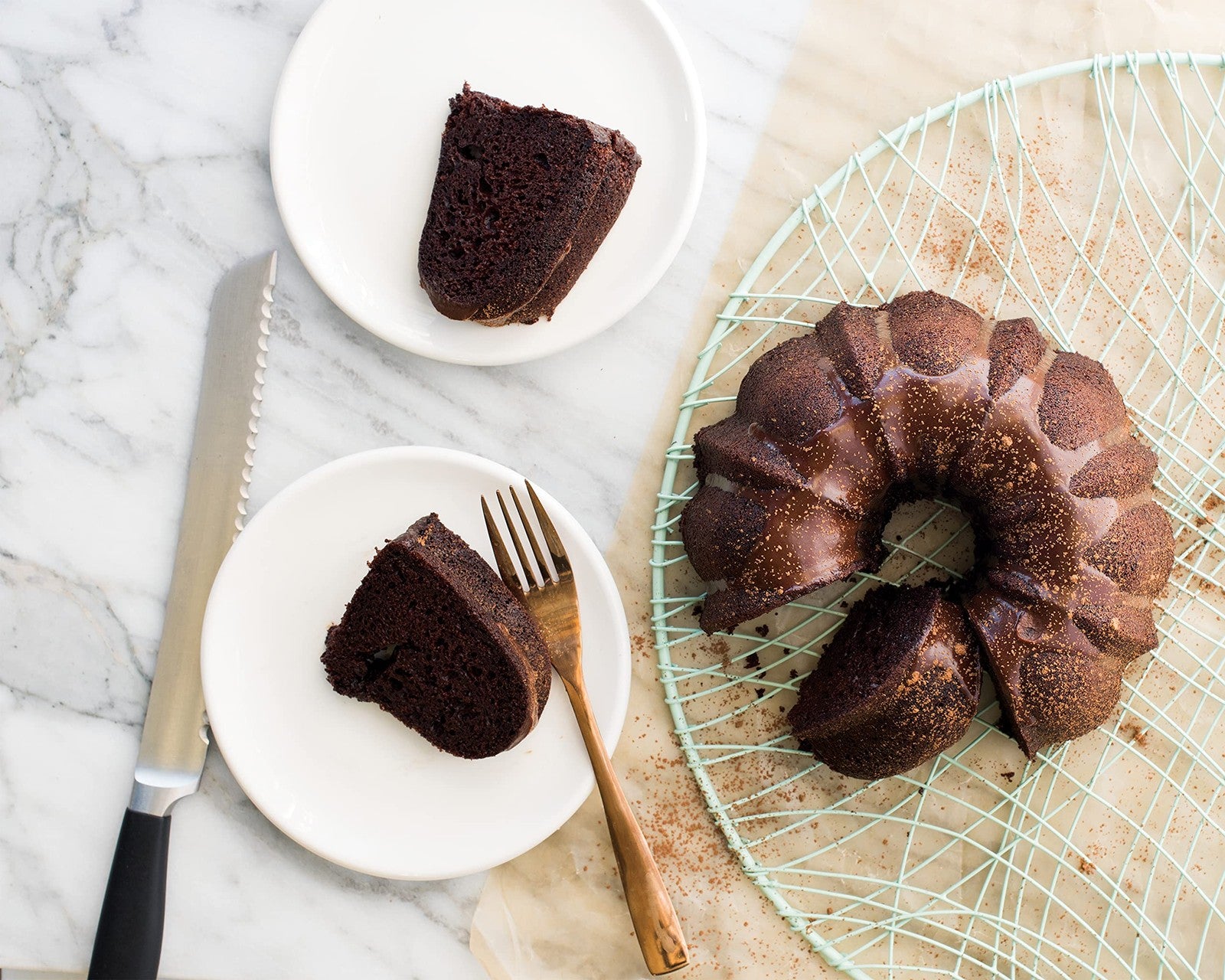 Nordic Ware Platinum Collection 6-cup Bundt pan with intricate fluted design, perfect for baking decorative cakes.