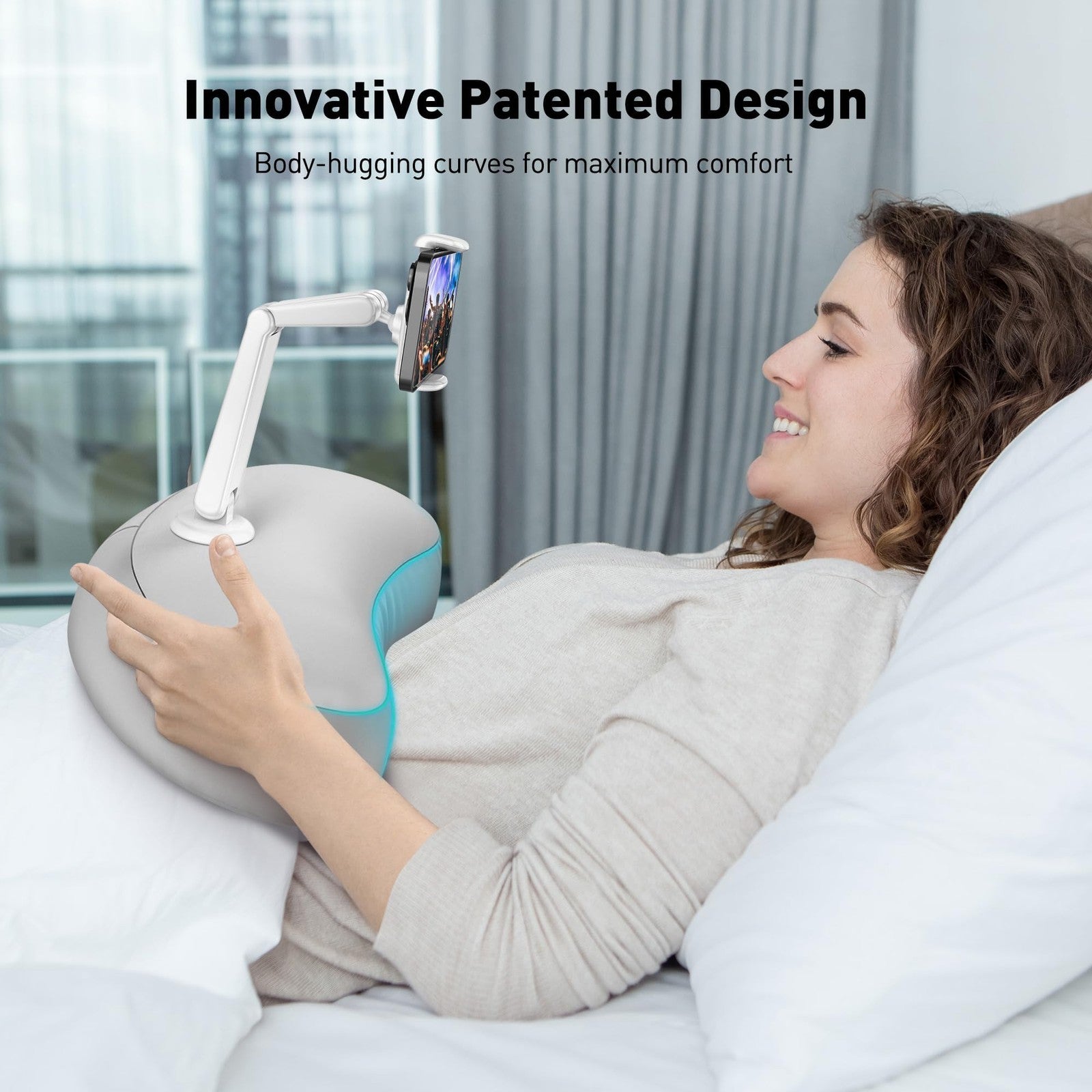 Flexible arm pillow phone holder for bed, with a rotating design, supporting smartphones comfortably on a desk or bedside.