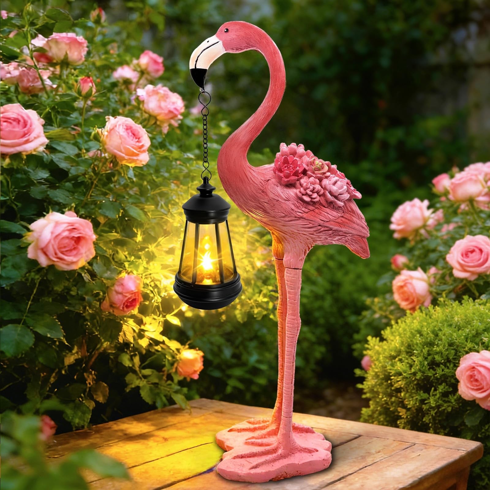 Yulloyello flamingo solar garden statue, 18.9-inch pink flamingo figurine with hanging solar lantern in a garden setting