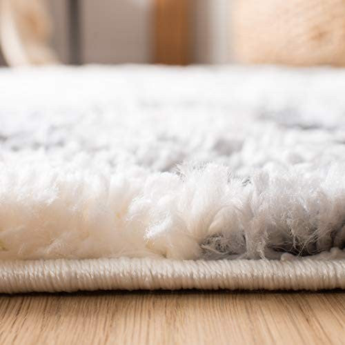 Safavieh Moroccan Tassel Shag area rug, 53-inch round in ivory and grey with boho tassel details on plush shag surface.