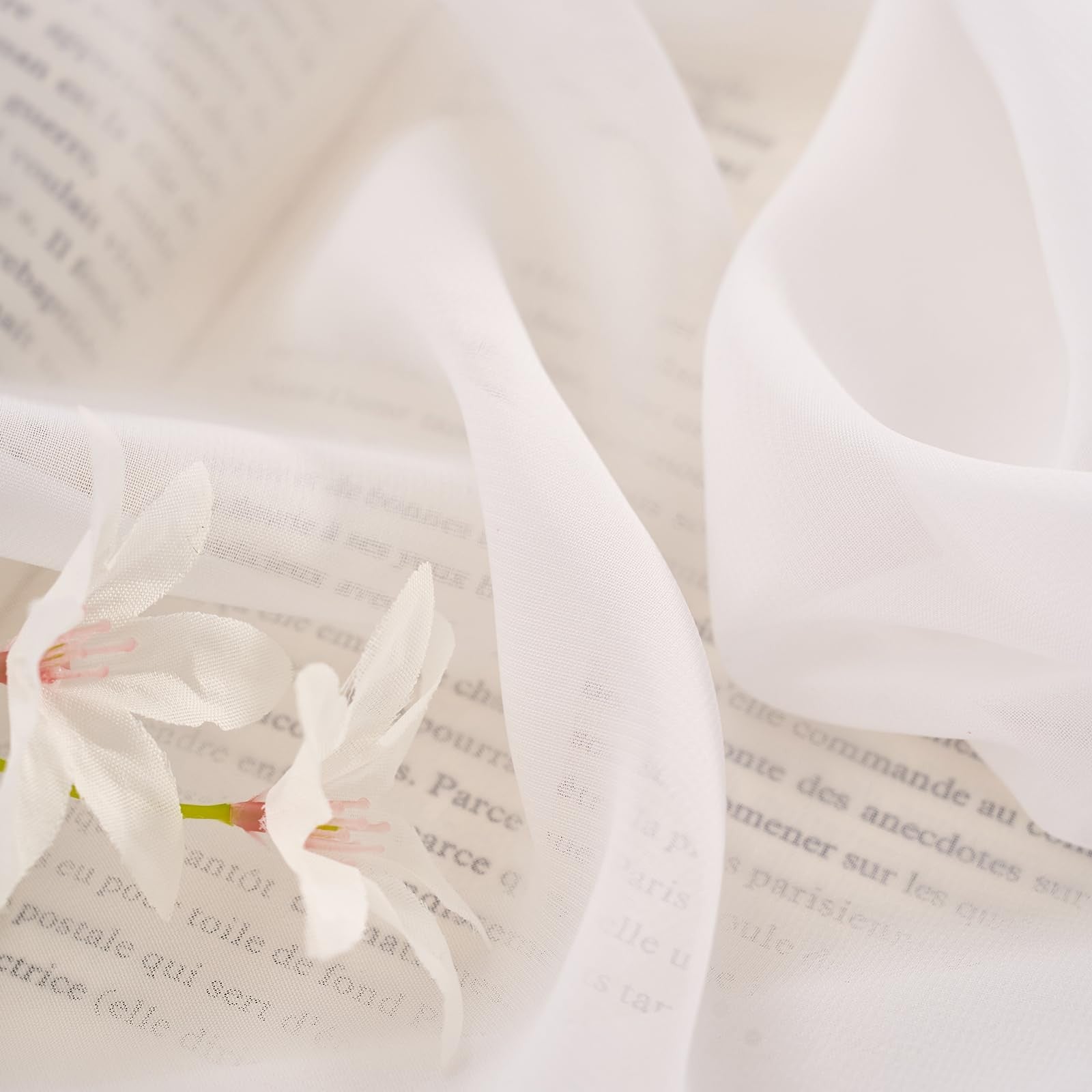 LUGOTAL Pure White 90-inch long chiffon sheer curtains with pinch pleats, showcasing elegant, flowing fabric for window decor.