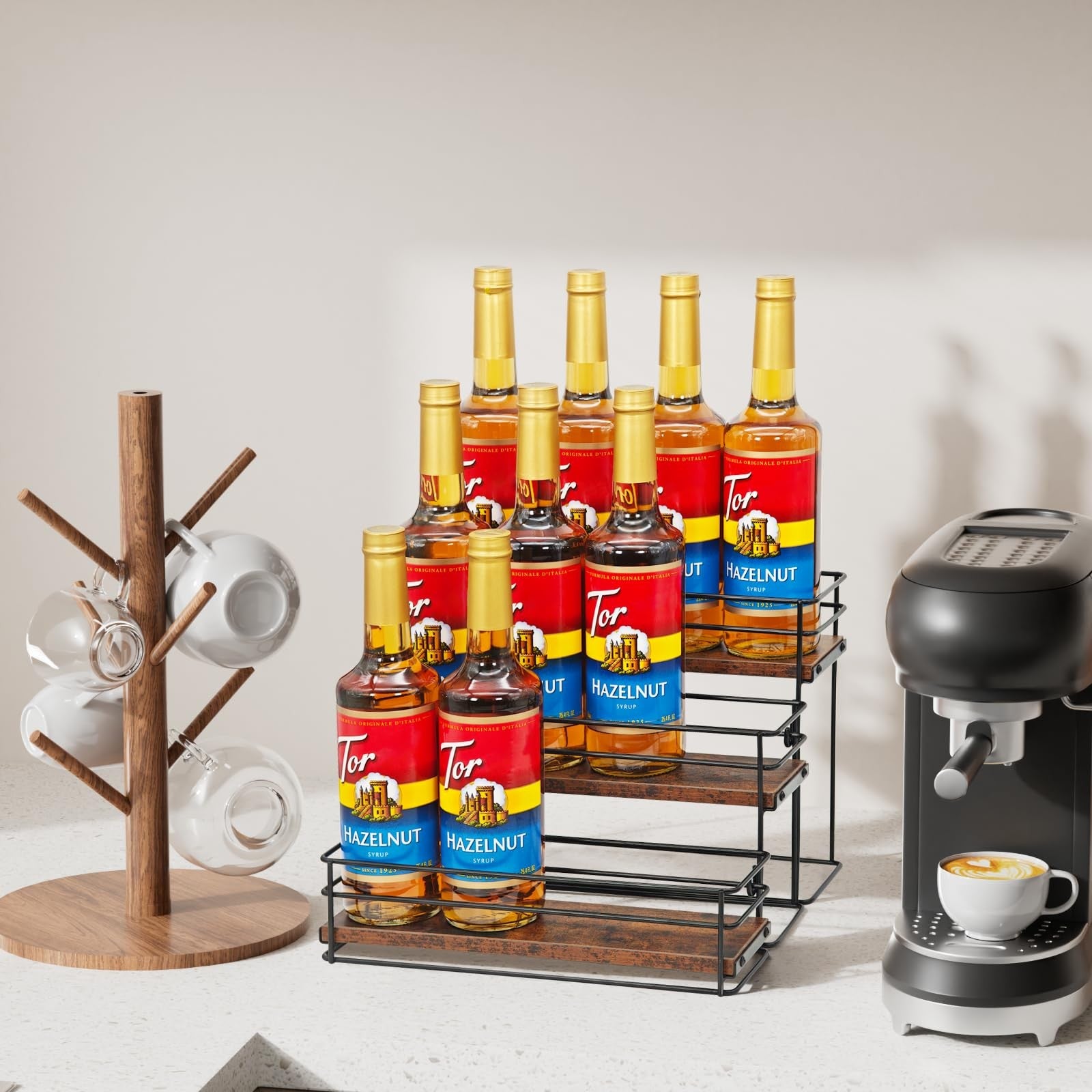 AUATRONNE 3-tier coffee syrup organizer rack holding 12 bottles, made of metal with a sleek design for kitchen countertop storage.