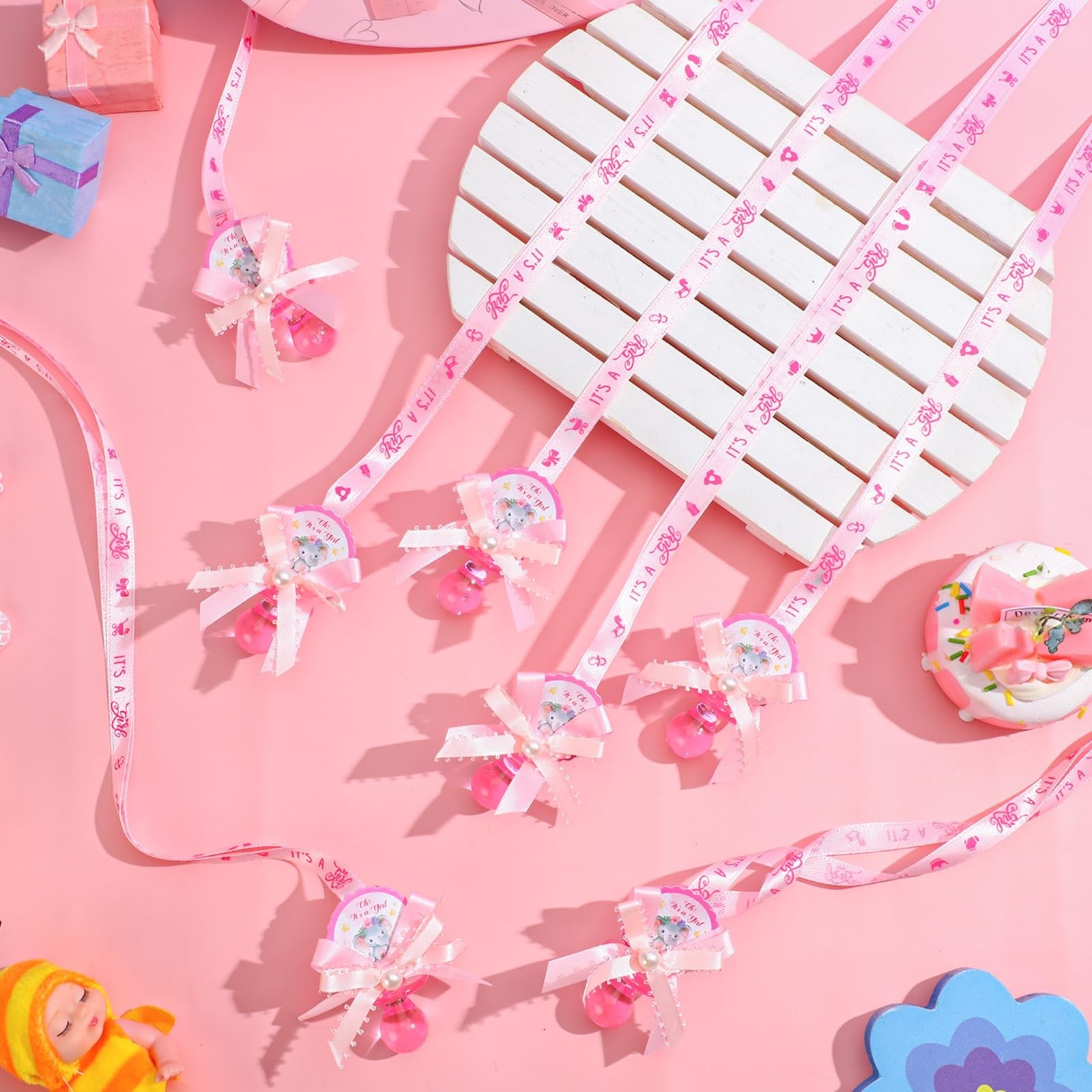 Remuuly 60 pink elephant acrylic pacifier necklace for babies, perfect as baby shower party favors, featuring a cute pink elephant design.
