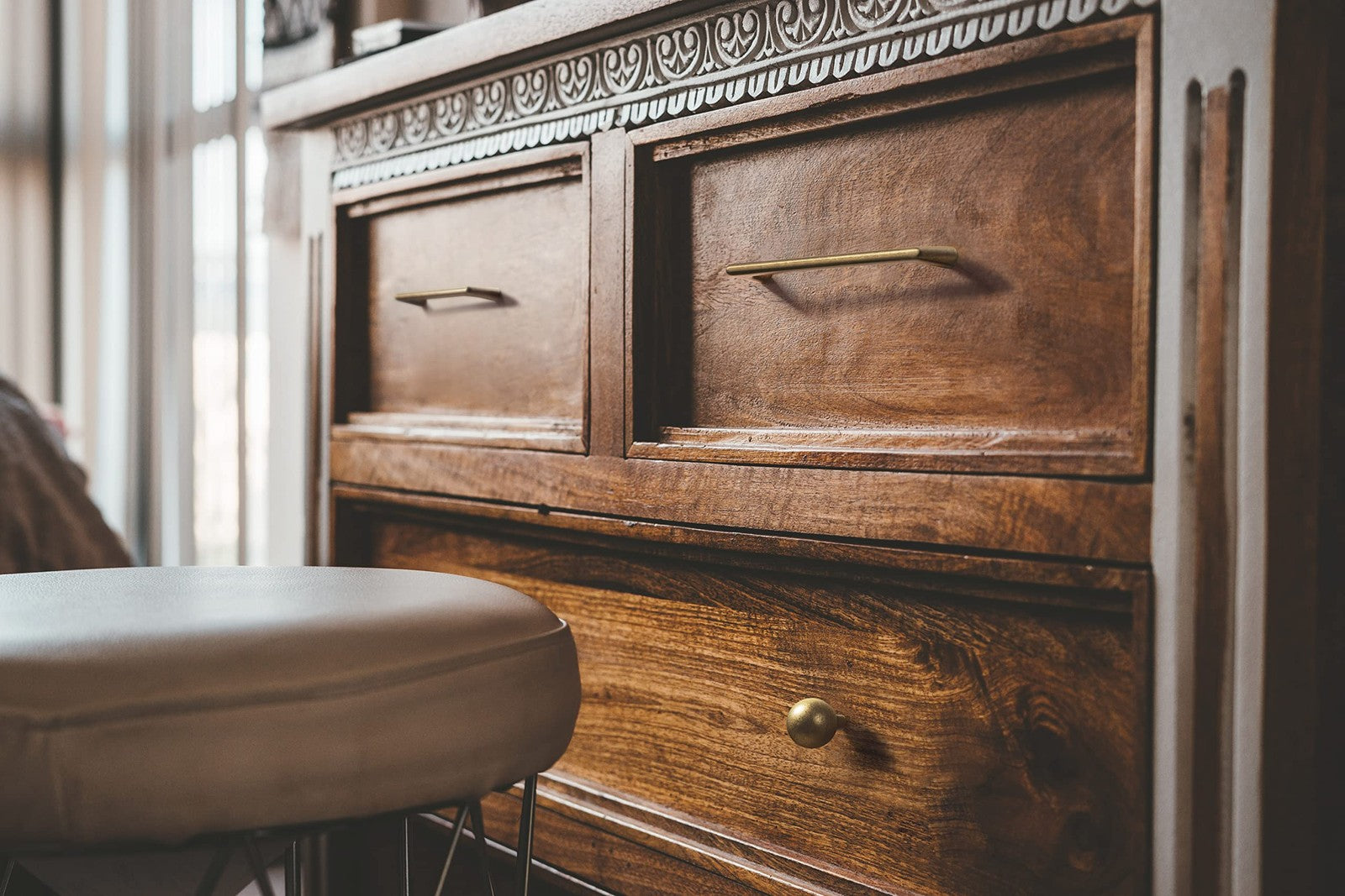 Goo-Ki antique brass zinc alloy cabinet pull handle on dresser or cupboard, showcasing its vintage design and sturdy construction.