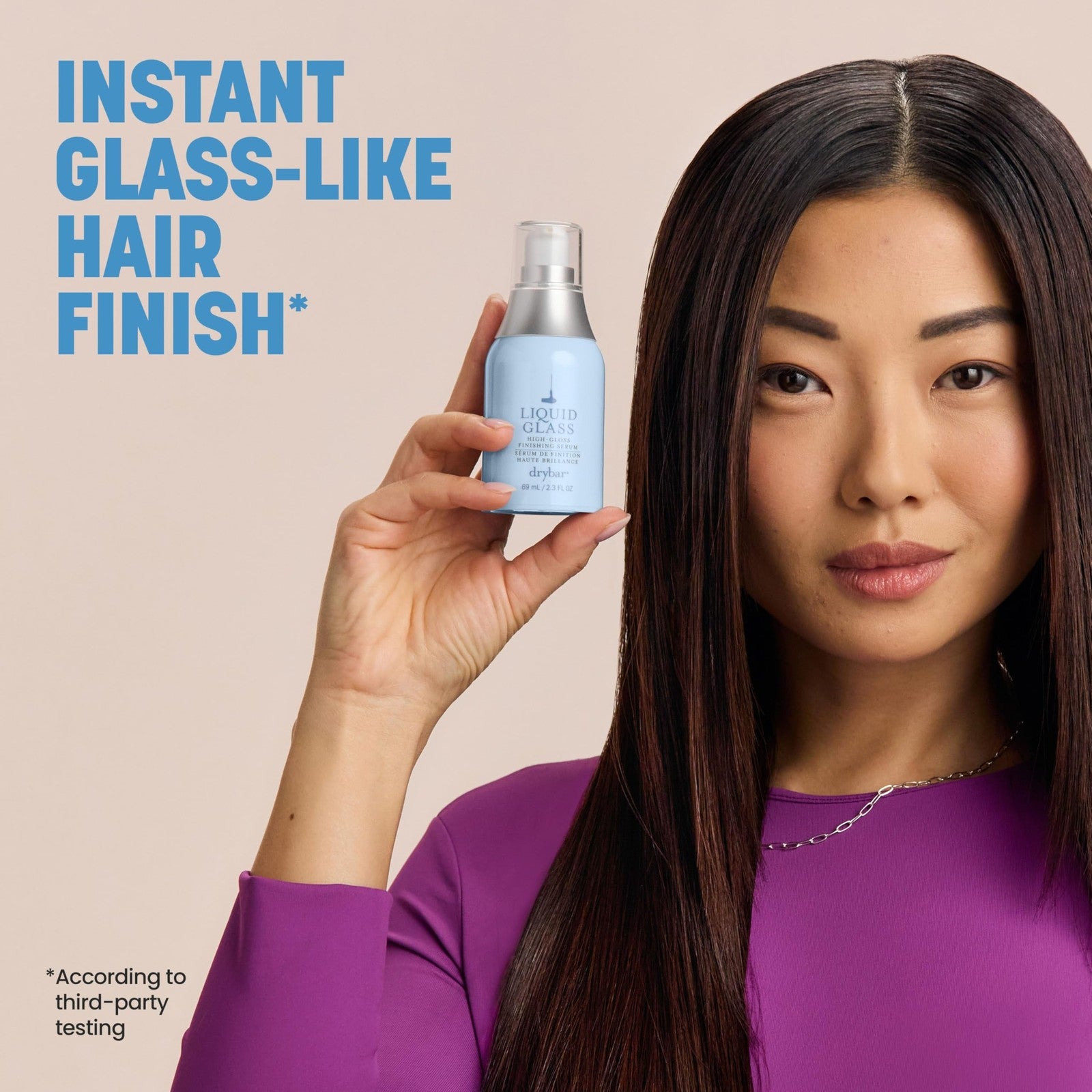 Drybar Liquid Glass High-Gloss Finishing Serum applied to shiny, smooth hair post-blowout, reducing frizz for a sleek finish.