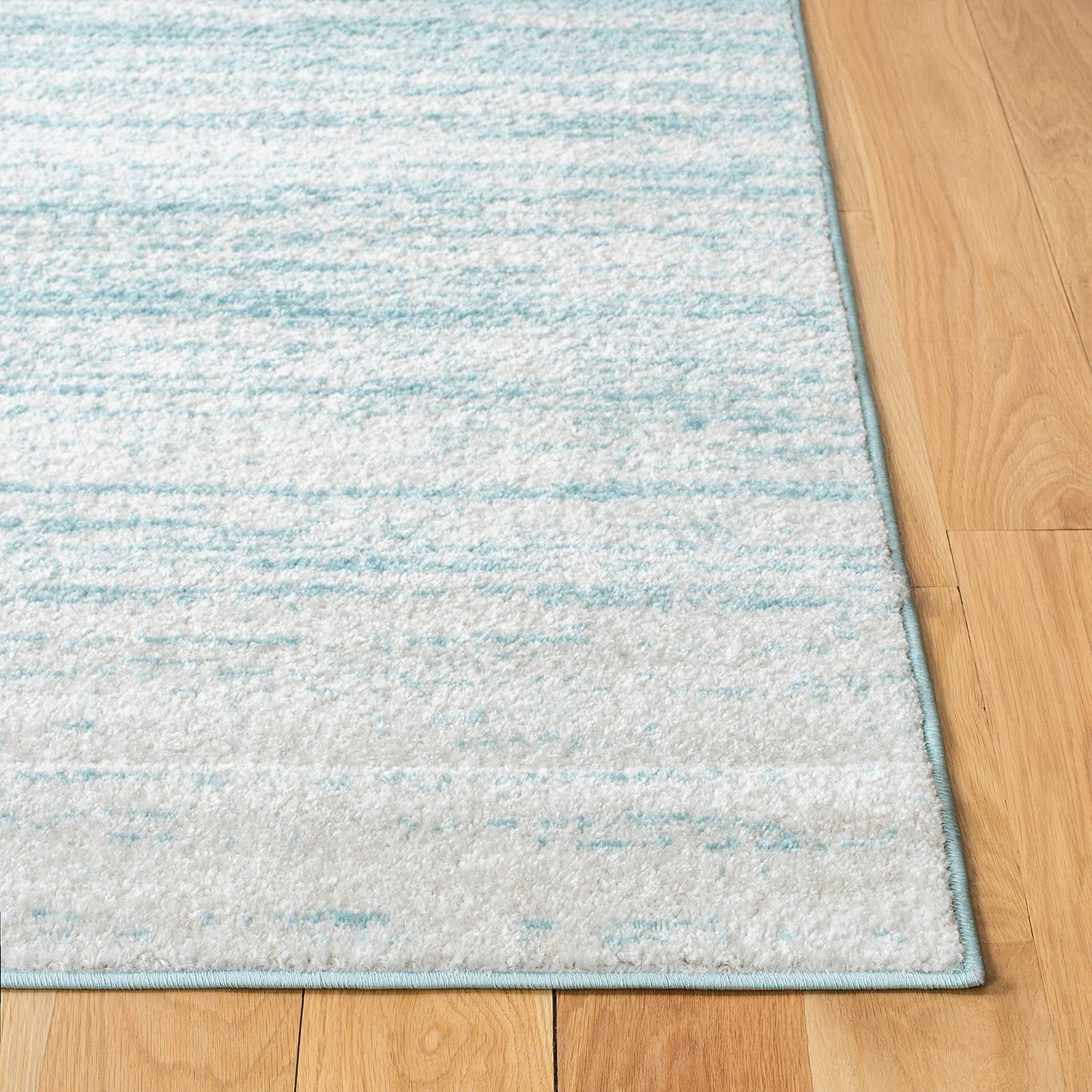 Safavieh Adirondack aqua ivory modern ombre area rug 6x9 with gradient design and soft textured surface.