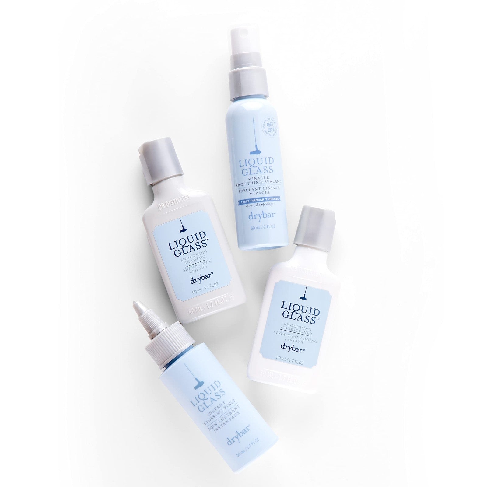 Drybar Glossy Gang On-the-Go Kit with frizz control and shine travel set, featuring small bottles of hair products and styling tools.