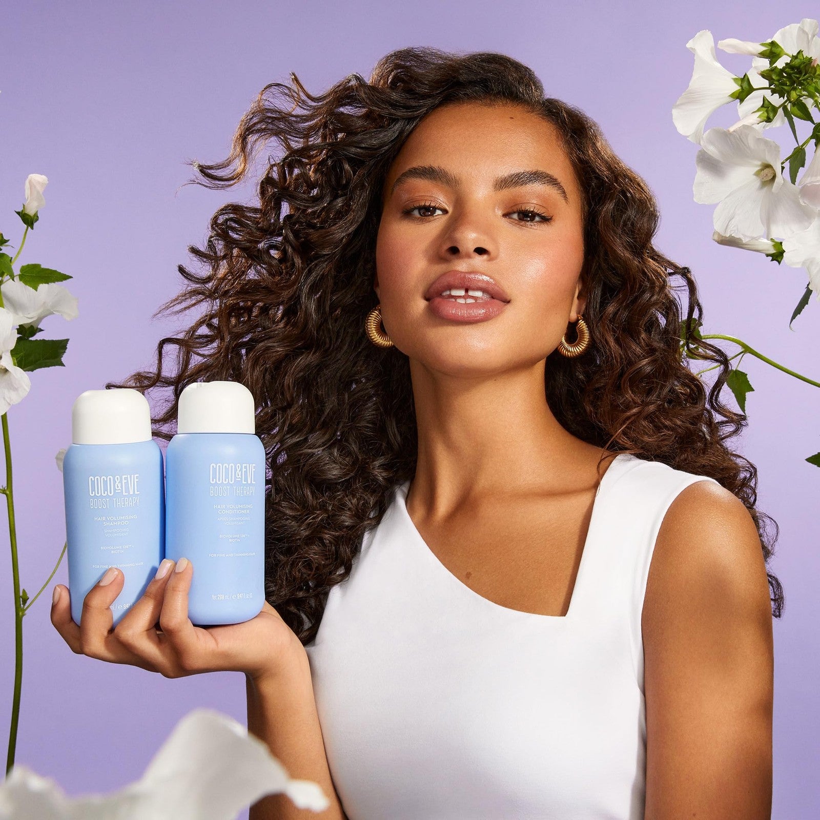 Coco & Eve Boost Therapy volumizing shampoo and conditioner bundle set with bottles and labels visible.